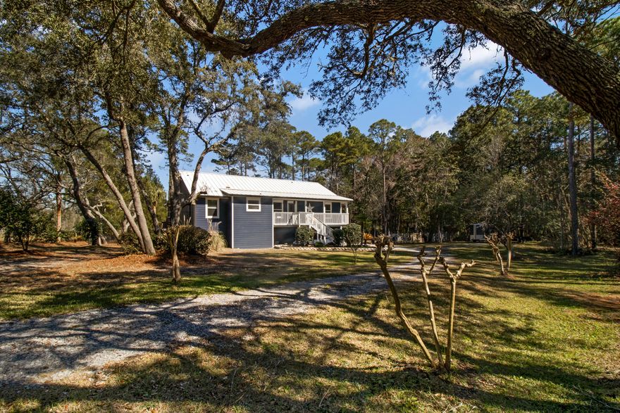 Looking for a peaceful, secluded waterfront home? This stunning 3-bedroom, 2-bathroom property is located on a quiet, dead-end street with no through traffic. Situated on East River, this home offers picturesque water views with 273 feet of waterfront, and includes a covered dock with a slip, providing easy access for your boat, jet ski, or kayak. The river connects directly to East Bay, offering expansive waterways for all kinds of water activities. Plus, a nearby boat launch makes it convenient to take your watercraft in and out of the water. This property also includes a spacious 3-car garage, a workshop, and abundant storage space on the entire first floor, offering plenty of room for all your needs. All living areas are located on the second floor, where you'll enjoy stunning views of the river. Inside, you'll find travertine flooring throughout the main and wet areas, with new carpet in the bedrooms. The main living area features cathedral ceilings, creating a grand and open feel. The chef's kitchen is equipped with granite countertops, a commercial-grade gas stove with a double oven, flat griddle, warmer, and a custom hood range, perfect for preparing meals. The sunroom, with high-impact windows, offers a bright and inviting space to enjoy the views, while the wet bar makes entertaining a breeze. Step outside to the screened-in area off the master suite and sunroom, a peaceful spot to relax and unwind. The spacious deck and dock area are perfect for dining, entertaining, or simply taking in the scenery. With a durable metal roof, this custom home is built to last. Whether you're fishing on the water or relaxing by the dock, this setting is ideal for both outdoor activities and entertaining.