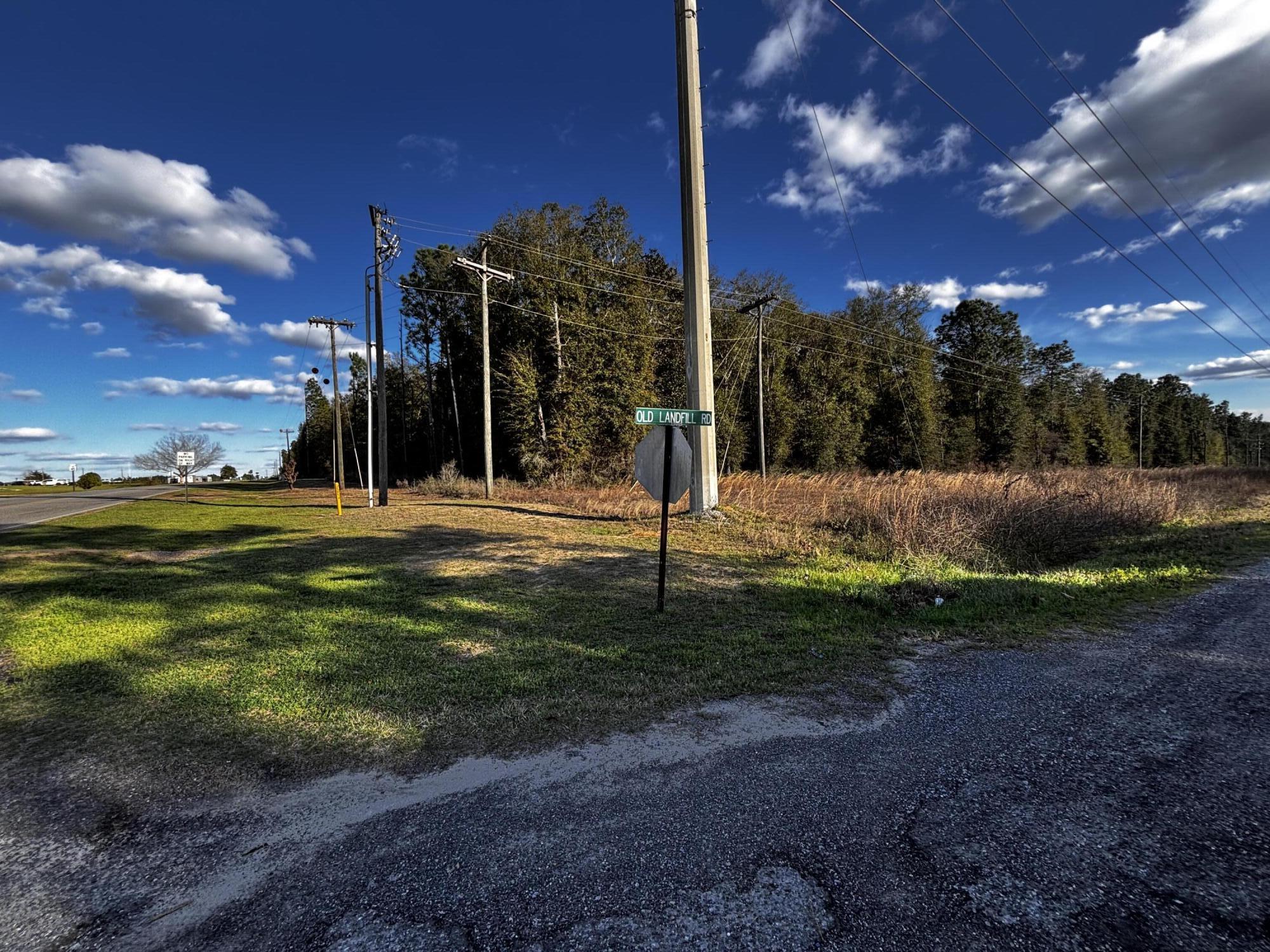 Discover a unique opportunity with this expansive 40-acre wooded corner lot, ideally situated with approximately 1,235 feet of road frontage on WWII Veterans Rd. and 1,304 feet on Old Landfill Rd. This property boasts a serene natural setting with a stream and very little wetlands in the lower southwest corner of the property, making it perfect for those seeking privacy, recreation, or potential development. Located across from the Walton Correctional Institution, this parcel is approximately 4.5 miles north of the charming DeFuniak Springs historical district, providing convenient access to local amenities while maintaining a peaceful, rural atmosphere. Utilities are readily available along the road, featuring power poles and telephone access. Whether you envision building your....... dream home, establishing a retreat, or exploring investment opportunities, this wooded lot offers endless possibilities. Don't miss your chance to own a slice of Florida's natural beauty!