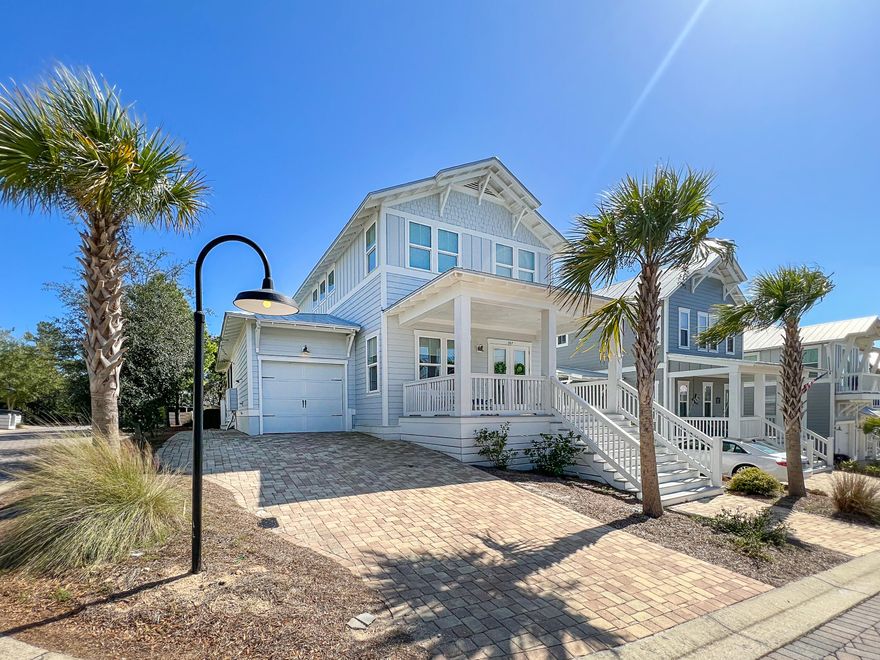 This beach house at Highland Parks on 30A is stunning! Located on the corner and with plentiful windows, the home gets washed in sunlight all day making it feel light and airy. The first floor features open main living areas, a gorgeous kitchen, as well as a spacious master suite. Upstairs you'll find a guest suite, two additional bedrooms, and a large hall bath. The stylish decor, furniture, shiplap walls, and wood floors give this home a chic coastal feel. Entertain your guests out on the screened patio or soak in the sea breeze on the large front porch. Take the nearby trail to the expansive pool area that features beautiful stone accents, fountains, fire pit, outdoor kitchen, and more! Beach days are easy since you're about a mile from the Blue Mountain Beach Access. Paradise!