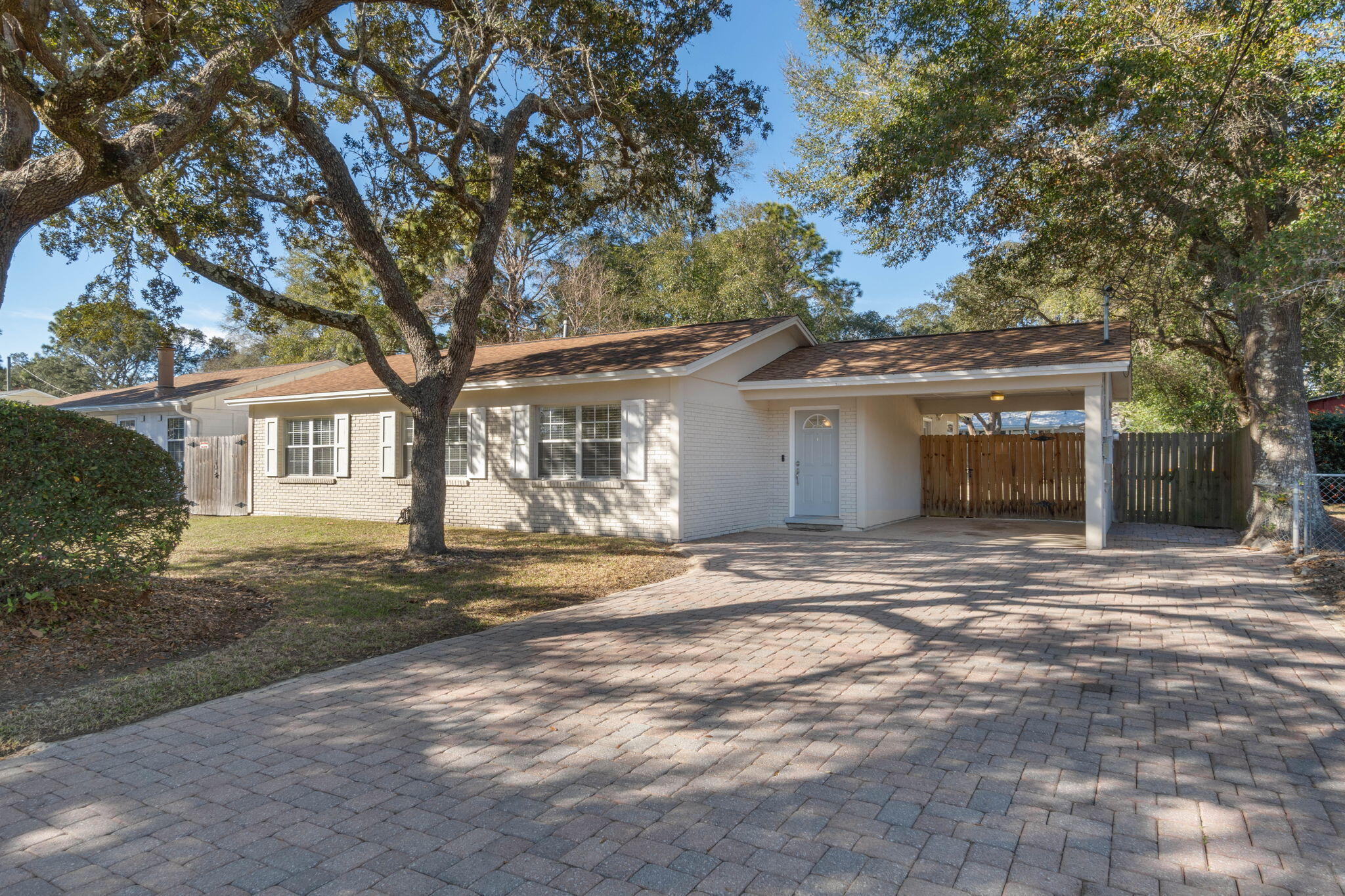 Welcome to your new home in the heart of Shalimar, FL. This charming 2 Bedroom, 2 Bathroom property is situated on a spacious lot in a quiet neighborhood. You can see the local park from the driveway. Plus you are only a short walk down to Meigs Beach. As you enter the home, you'll be greeted by a warm and inviting living room that boasts plenty of natural light and ample space for relaxing or entertaining guests. The adjacent kitchen features Stainless Steel Appliances, Custom Cabinetry, and Graphite Granite Counter Tops. Just off the kitchen, a cozy dining nook is the perfect spot for enjoying your morning coffee or a family meal. Both bedrooms are nicely sized with ample closet space. The Primary Bathroom features a walk-in closet, plenty of counter space, and a tile shower.
