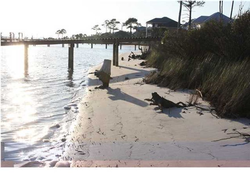Build your dream home on this fabulous waterfront lot with white sandy beaches! View the Santa Rosa Sound from anywhere on your lot, but a 2nd and 3rd story will give you impressive views of both the Santa Rosa Sound and the Gulf of Mexico! Make a reasonable offer and you may be surprised! If you are you ready to build your dream home, then you can allow the incredible views of varied marine life, yachts, and barge traffic on the Santa Rosa Sound to envelope your view from this Southern exposed lot! You'll catch views of the Gulf of Mexico, too, and you can add your dock to this pristine lot! Lounge and watch the parade on the water or jump in your boat and cruise to Pensacola to the West, Destin and Panama City to the East, and beyond! Please click on ''more'