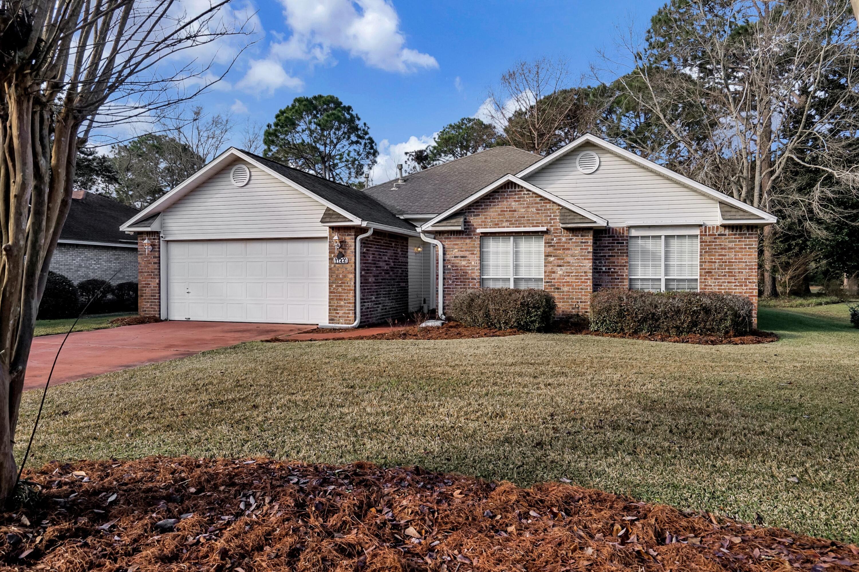 Beautifully updated low maintenance Brick home with NO HOA located in desirable Bluewater Bay community. Beautifully appointed with a spacious open concept floor plan and vaulted ceilings. The kitchen features STAINLESS STEEL appliances, GRANITE countertops & subway tile, wall oven, GAS range. Beautiful Vinyl Plank flooring throughout. NO carpeting in this home! Barn door feature as well as invisible pet fence comes with house. New Electrical box= 2019. Beautiful views & mature trees from the backyard. Comes with Hurricane shutters for peace of mind. Located in Top rated Niceville School district with nearby parks, golf, pools, tennis courts and bike paths available.Seller is willing to put on a new roof with an acceptabe offer.