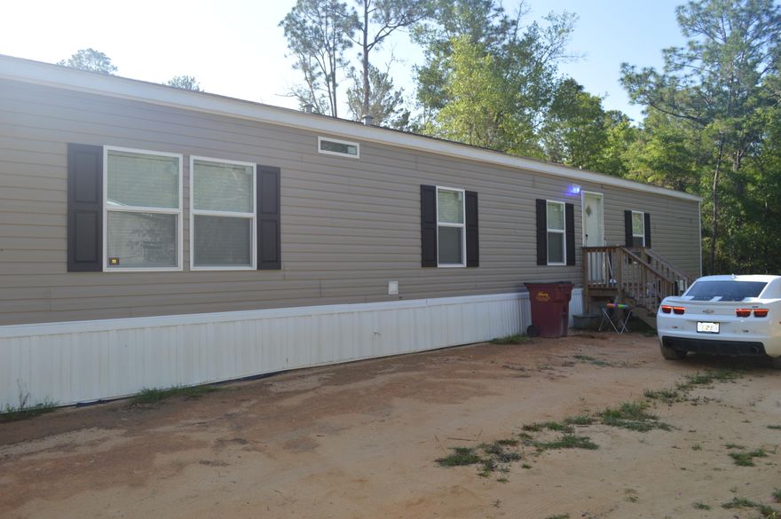 Welcome to The Pines neighborhood, where tranquility meets modern living! This charming 3 bed, 2 bath manufactured home offers a comfortable and spacious retreat for you and your loved ones. With 1,149 sq ft of living space, this home is perfect for those seeking a cozy yet stylish abode. The kitchen features a convenient island, ideal for meal preparations and gatherings. Enjoy the ease of a dishwasher, making clean-up a breeze. Stay cool during warm summer days with the central air conditioning system, providing optimal comfort throughout the year. Don't miss out on this fantastic opportunity to own a delightful home in The Pines.