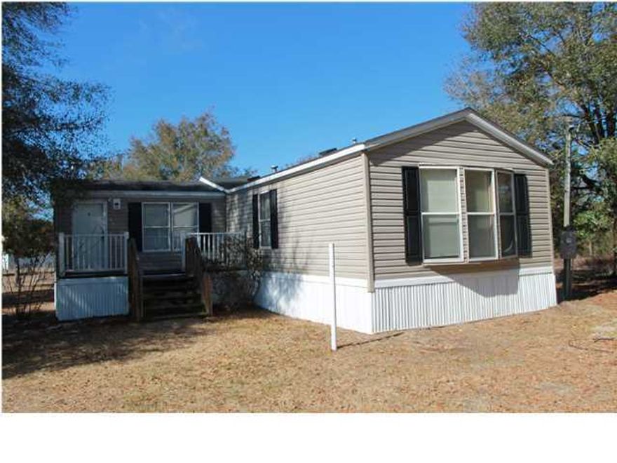 This manufactured home is immaculate! Located on a large lot. Living room with wood burning fireplace. Spacious kitchen with center island and plenty of cabinet space. Large master bedroom and master bath. Double vanity sink, garden tub and separate shower. Nice deck off living room that overlooks back yard. Buyer must verify all measurements.