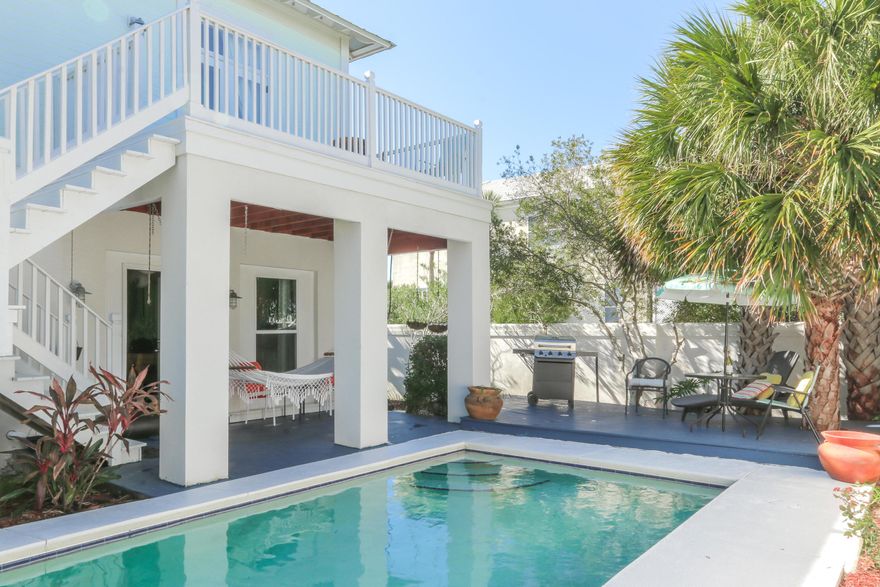 ACT NOW.  ONLY VACATION RENTAL HOME W/PRIVATE POOL ON MARKET FOR LESS THAN $500,000! Located in Destin Pointe, a beautiful, gated community just steps to the Gulf, earn an estimated $44-$67,000 NET income or 9-13% ROI.  With excellent location & floor plan, and 90-98,000 annual projected income, start letting your CASH work for you. The creative floor plan w/ main living area, kitchen, 2 BRs each w/own bath & large balcony on 2nd level and 596 SF renovated 1st level designed to reflect Destin's original fishing village--rustic--but practical w/2 add'l beds, bath w/shower & kitchenette, provides multiple rental possibilities. Fenced backyard w/private pool & deck allows you to enjoy the Fl. lifestyle & single car garage provides storage or room to expand rental space. Other features include high ceilings, 2 yr old HVAC, wood floors and travertine baths. 
Destin Pointe, a beautiful gated community on Holiday Isle, offers 3,000' of private deeded beach, two community pools, 24-hour security, tennis courts, clubhouse and several picnic areas throughout the community. Fantastic restaurants, shopping and entertainment are close by.