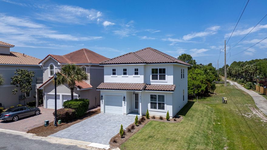 Discover unparalleled coastal living at Calusa Bay, an exquisite gated community nestled in the heart of Destin. This new construction home offers a perfect blend of elegance and modern convenience, featuring four spacious bedrooms, each with its own en-suite bath. Ideal for a primary residence or a second home, this property prohibits short-term rentals, ensuring a serene neighborhood atmosphere. Every detail of this home exudes luxury, from the quartz countertops and luxury vinyl plank flooring to the tankless water heater and epoxy-coated garage floors and porches. The kitchen boasts new stainless steel appliances and a breakfast bar, seamlessly integrating style and functionality. On the first floor, a guest bedroom with an en-suite bath and walk-incloset provides convenience And privacy.  Upstairs, two additional guest bedrooms each with en-suite baths, while the master suite offers a double vanity and a spacious walk-in closet.  Seperate HVAC zones for the first and second floors ensure comfort throughout the home.  Calusa Bay's community amenities include a sparkling pool, scenic ponds and a new walking path along Highway 98 leading to Destin Commons, perfect for shopping and dining.  The community is centrally located near Whole Foods, Destin High School and Destin Middle School.  Enjoy proximity to Regatta Bay Golf and Yacht Club for championship golfing and Legendary Boating Club for hassle-free boating.  Embrace a low-maintenance lifestyle with affordable HOA fees.  This location offers close proximity to the beach, shopping, and entertainment,  making Calusa Bay Retreat the ultimate destination for luxurious and convenient coastal living.