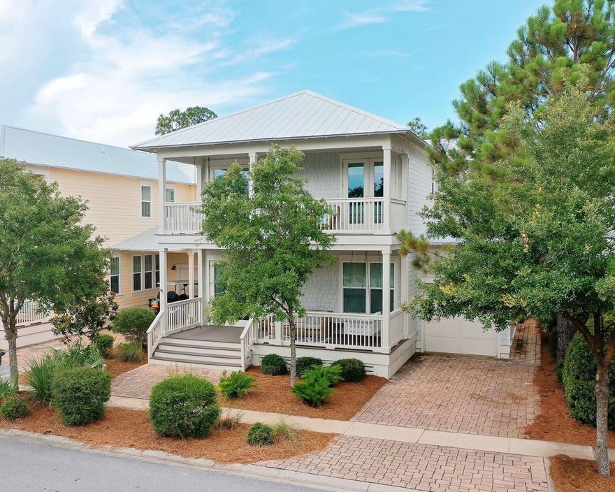 At SeaHunt, comfort and style unfold with ease in the heart of NatureWalk at Seagrove; a prized community bordering Watercolor and Seaside on Hwy 30A. Designed to accommodate both laid-back beach days and lively family gatherings, this five-bedroom retreat offers gracious living surrounded by nature preserves, resort-style amenities, and a warm, coastal aesthetic. The main level welcomes with bright, open spaces wrapped in natural light and French doors that open to a spacious screened porch. The kitchen is a true standout, with granite countertops, a generous island, gas range, stainless steel appliances, and a large walk-in pantry. A first-floor guest suite adds flexibility for multi-generational stays, while the upstairs primary suite offers a peaceful sanctuary with a soaking tub, walk-in shower, and screened balcony overlooking the community forest. Two additional guest rooms share a charming front balcony, and the oversized bunk room with two twin-over-full bunks comfortably sleeps six. Outdoors, the back patio is perfect for grilling after a beach day, and the screened porch invites slow mornings with coffee or shaded evenings with cocktails. NatureWalk's amenities include a large zero-entry pool, a seasonally heated lap pool, a shaded kiddie pool, a hot tub, a playground, a bar area, and grilling stations, all set amidst trails that weave through untouched native landscapes. Whether you're seeking a family home, a luxurious vacation escape, or a rental investment, SeaHunt delivers laid-back luxury in a location that's equal parts secluded and connected