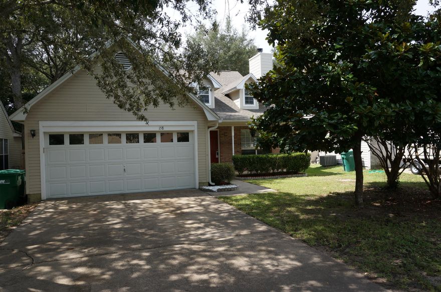 Cute home tucked away in Indigo Village of Bluewater Bay. Conveniently located to shopping, schools, and the beautiful beaches of the Emerald Coast. The home has been meticulously maintained and shows pride of owner ship. The two story home with easy maintenance vinyl has a master bedroom on the first floor. The living room has vaulted ceilings, ceiling fan, a wood burning fireplace and natural light from dormer windows. The carpet was replaced in 2011 and is in fabulous shape. The combination kitchen and dining area has tile floors, hardwood cabinets, and granite counter tops. The JenAire stove comes with additional accessories for cooking your favorite meals. The master bedroom has slider doors leading to private fenced back yard, carpet, and ceiling fan.