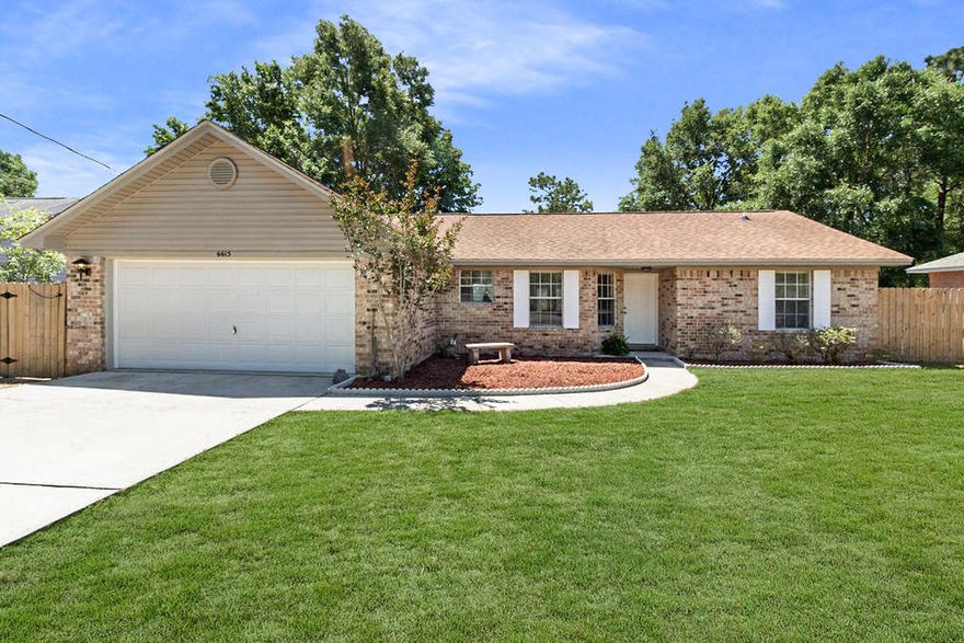 Meticulously maintained home in Milton's Cedar Ridge Subdivision - This 3 bedroom 2 Bathroom home backs up to King Middle School and is the perfect family home with easy access to everything in Milton and minutes to Whiting Field. The current owner has made many recent updates including new bamboo flooring in the bedrooms, new wood-look tile flooring in the living areas and kitchen, new blinds in all rooms, newer fixtures, new french doors, new garage entry door, new stove, new microwave, new dishwasher, new wall safe, 2011 HVAC, and more! This home sites on a large lot with the back yard fully fenced for privacy. Walking into the front door you are immediately greeted with the new wood-look tile flooring and gorgeous new wooden accent wall in the living space. To the left, there is space for a formal dining area or office / reading nook. This lovely home has a split open floor plan with the master bedroom off of the kitchen that features new appliances and hardware. The master bathroom features a large garden tub / shower combo, double vanity, and TWO walk-in closets - one of which has a new wall safe installed and also a new access panel to the plumbing. The laundry room is also off of the kitchen and leads to the large 2 car garage. The other two bedrooms with the gorgeous new bamboo flooring and upgraded fixtures are located off of the living space with a full bathroom in between them. The new french doors and bay windows in the breakfast / dining area allow for ample lighting throughout the living and kitchen area. With all of these wonderful updates and location, this one will not last long!