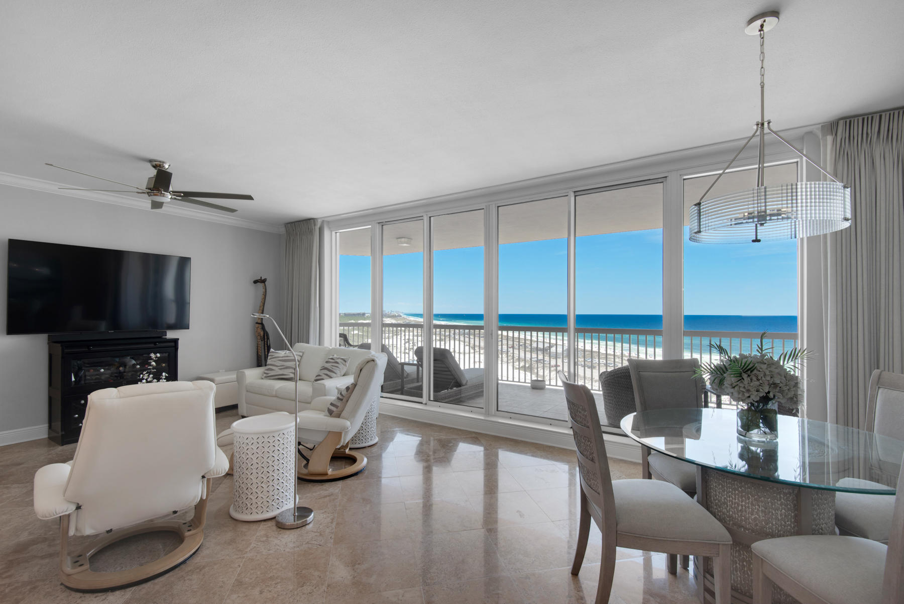 This gorgeous 10th floor condominium residence( with the best views and is the most desirable condominium complex in Destin. This open floor plan has unparalleled views from almost every room of the Gulf of Mexico across the incredible white sand dunes of Henderson Beach State Park. the turquoise waves, sea life sightings, the calling of birds, and lush greenery from the natural foliage of the park make this location super special. The huge deck allows for enjoyment of the setting night and day, and ceiling-to-floor windows extend the beauty indoors. In immaculate condition, the residence offers upgraded quartz kitchen counters, glass backsplash,