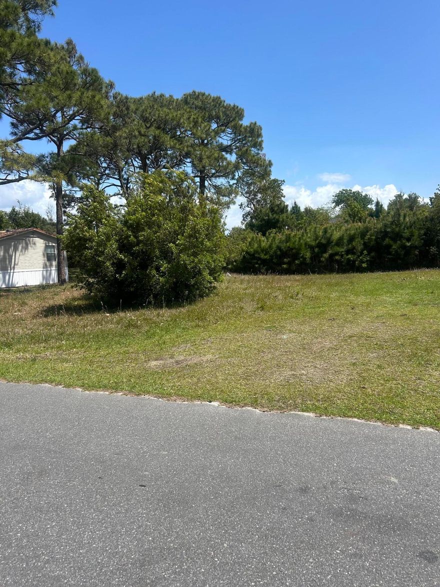 Prime vacant lot located in the desirable North Lagoon Oaks subdivision, less than a mile from the beach. This versatile property is zoned for single-family or duplex, making it perfect for building your dream home, a vacation getaway, or an income-producing rental.Existing survey.