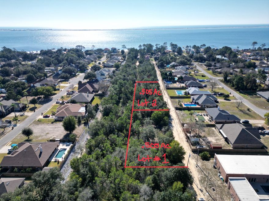 .505 Ac interior lot zoned R1 with Frontage 220. According to GIS map no wetlands are on property , x flood zone, see photos for other pertinent information . Additional .51 acre Lot MLS #991908 on market for sale as well. Setbacks F25'  R25' S15' soil is Ortega Sand, 0-5% slopes not a Hydric soil. SEPTIC needed water at street and sewer on 98