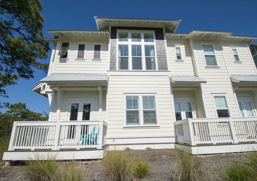 End unit in popular Prominence development. Hardwood floors, granite countertops, 10' ceilings in this sleek and upgraded townhome. Resort style pools, a fitness center as well as easy access to The Hub for dining, shopping, concerts and movies. And private shuttle to the beaches! This townhome borders the state forest, offering additional privacy.