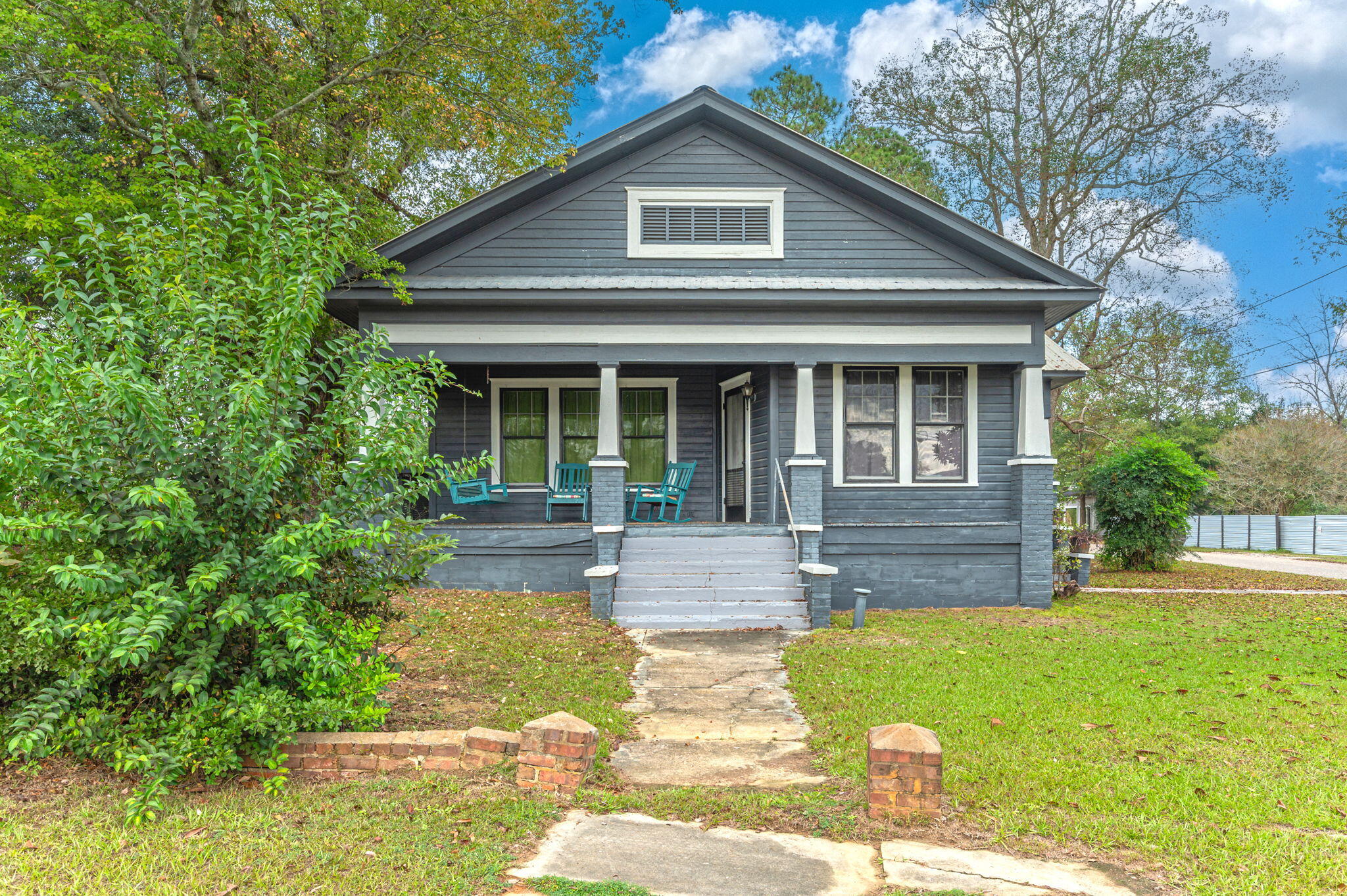 Located in Beautiful Florala, Alabama this Historic updated home offers charm, character, and tons of room! Home welcomes you with alarge covered porch that enters into home! Home has a large living room with a connecting screen porched, separate dining area offkitchen and a perfect kitchen with tons of cabinets. The home offers a great foyer/hallway that locates all the bedrooms to the left side ofhome with a great large primary bathroom. Home has original hardwood floors, lots of storage, and also includes new HVAC system.Home includes a large 19x16 separate building for game room, home office, or entertain area that has plumbing in place. Home alsoincludes a covered carport; tons of covered patio arears and a great corner lot yard!