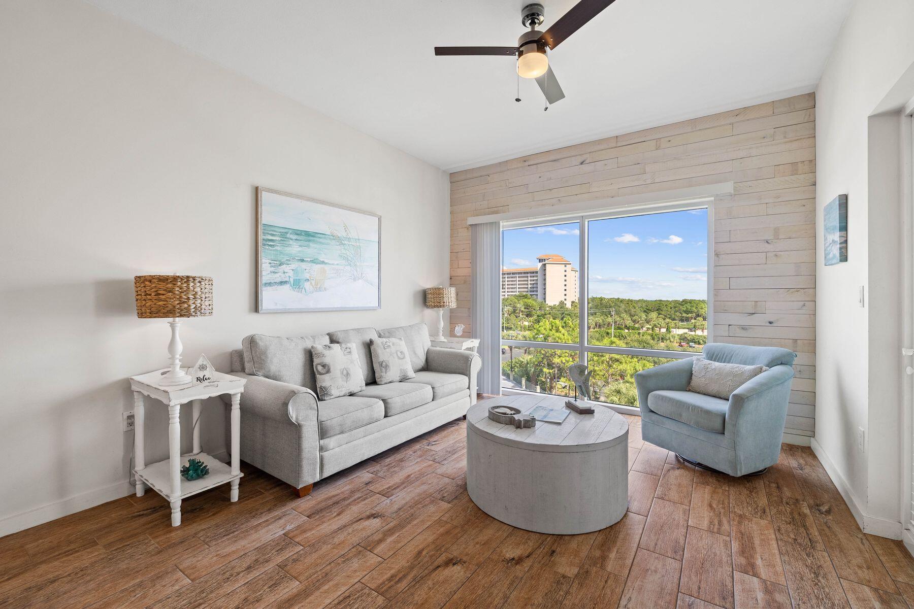 Experience coastal living at its finest in this beautifully decorated fourth-floor one-bedroom condo located in Luau II. With impressive easterly views from the large private balcony, this property offers the perfect retreat for relaxation. The interior is designed for both style and ease of maintenance, featuring wood-look plank tile flooring and charming shiplap accent walls. The well-thought-out layout includes a full-size kitchen, a cozy dining area, and a comfortable living room complete with a sofa bed, making it ideal for hosting friends and family. The separate bedroom boasts a king-sized bed and an en suite bathroom, providing a private sanctuary for restful nights. This condo comes fully furnished and is ready for immediate use, whether you're looking for a permanent residence, a vacation getaway, or an investment property. Residents of Luau II enjoy a variety of amenities, including a tropical resort-style pool with a swim-through waterfall, a kiddie pool, a hot tub, and a seasonal tiki bar. Additional features include a BBQ and picnic area, private beach access, a fitness center, and convenient storage options. For parking, you'll have access to both covered garage and deck parking. Elevate your experience with breathtaking views and sunsets year-round from the rooftop observation deck. Situated within the gates of Sandestin Golf and Beach Resort, this property provides unparalleled access to world-class golf courses, tennis and pickleball courts, and a full-service marina. Don't miss your chance to own this exceptional condo in a prime location, where comfort and convenience meet the beauty of coastal living. Schedule your viewing today!