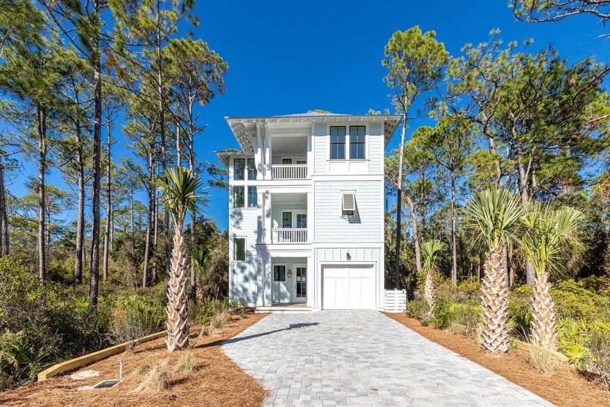 Surround yourself in nature in the quaint community of Treetop Village, with this new construction home that offers the best of both worlds: Gated privacy and two entry/exit points for easy access to 30A through Seacrest Beach and Highway 98. This home is currently in the final stages of construction, offering five bedrooms, four and a half baths, and a garage in a serene location that backs up to a nature preserve. Treetop has deeded beach access, tram service to the beach, and a community pool. Its positioning and features are ideal for either primary living or investment opportunities.
The home has a commanding three-story footprint and covered porches are plentiful for capturing peaceful outdoor moments. Designed for first-floor living with finely-appointed details and finishes, the open great room offers plenty of space for the whole family. A gourmet kitchen with shaker cabinets, quartz countertops, and stainless appliances, and gas plumbed for grilling outdoors complete your entertainment package. The second floor includes three bedrooms, two of them are Primary suites with luxurious accommodations. Notable features include 9 inch wide flooring, coffered ceilings and shiplap accents throughout. The third floor offers 2 more bedrooms with a generous sized bathroom and a bonus living area, the perfect set up for kids. Treetop provides an incredible lifestyle opportunity with its larger sized lots and preserve space, yet it's a short walk, bike or golf cart ride to the world-class shops and restaurants that dot the communities of Seacrest, Alys, Rosemary Beach and 30Avenue.