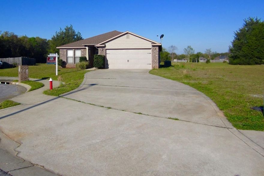 Come see this BEAUTIFUL open floor plan home in the wonderful subdivision of Pace Mill Creek! Best lot in the neighborhood on a cul-de-sac with an extra long driveway. This home boasts durable Tranquility Resilient vinyl tile flooring throughout the living areas and matching wood-laminate flooring in the bedrooms. As you walk into the kitchen you will find gorgeous cherry cabinets with granite countertops and an EXTRA long granite high-top bar surrounding it that could easily fit 8-10 stools! The spacious master has an on-suite with a double vanity, large garden tub and separate shower as well as a HUGE walk-in closet! Off the back of the house you'll find a covered patio and don't forget about the two car garage!