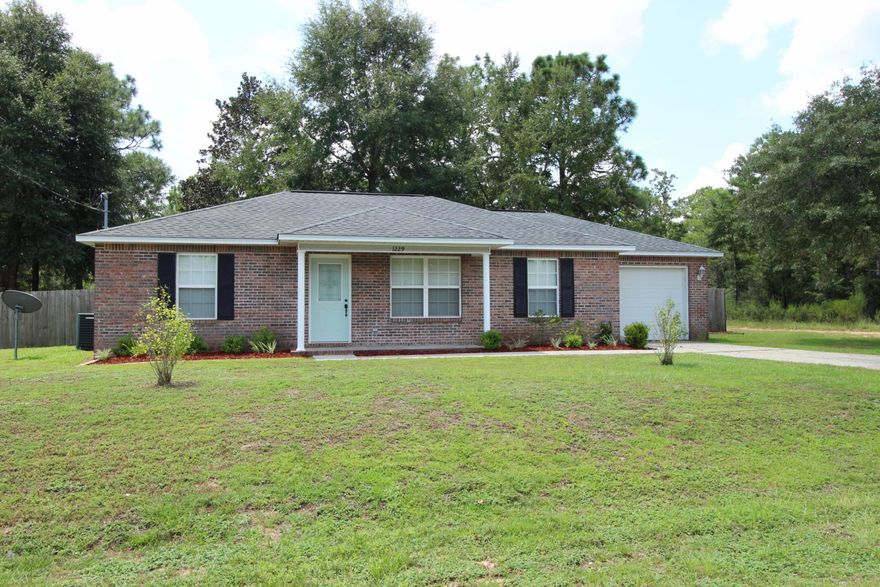 Updated and move in ready, this brick front rancher on a corner lot has a huge privacy fenced in back yard and covered patio. When you enter, you'll find vaulted ceilings and freshly painted walls, along with new vinyl flooring. Leading into the breakfast area and then over to the open, galley style kitchen with separate pantry. French doors lead to the covered patio and gloriously large back yard! And because it is a corner lot, there's room for the double gate entry into the yard from the side. With a split floor plan, the master offers a nice size walk in closet. Also featured is a 1 car garage and covered front porch. Qualifying for all types of financing, the seller is offering a home warranty up to $500 and $1000 in buyer closing costs with a full price offer!