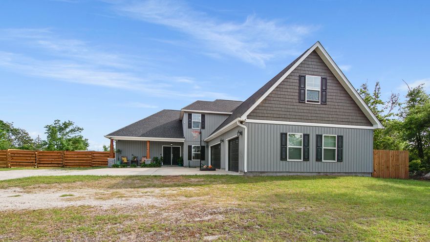 Nestled in Panama City's serene Deer Point area this stunning 2-story Craftsman style home built in 2018 must be seen to be appreciated. Spaciousness abounds with just under 3300 sq.ft. of luxury living.  Boasting 5 BR, 3 full baths, an office, an oversized 3-car garage, and large bonus room, it's a haven of comfort. The wraparound veranda with cable hookup helps complete just over 5200 sq. ft. under roof and opens to the large backyard with garden to enhance its allure. Inside, cathedral ceilings in the living room open to the dining room and the tastefully designed kitchen which includes stainless steel appliances, self-closing cabinetry, and granite countertops. The owner's suite pampers with quartz countertops, an oversized 6ft jacuzzi tub, walk-in tiled shower, and walk-in