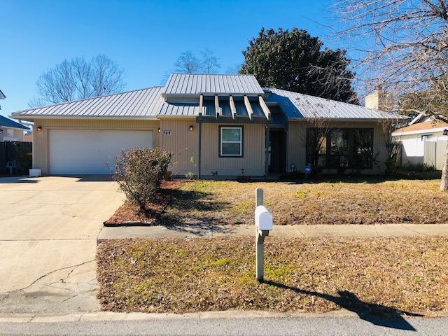 This lovely cottage style home in the heart of Destin is a must see!!! It has so much charm with an open floor plan, vaulted ceilings in the living room and dining room, a stone faced wood burning fireplace and beautiful wood flooring. It has a metal roof and both the kitchen and bathrooms have been recently remodeled.