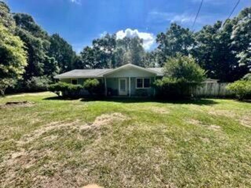 2 bedroom 2 bath home with small flex room ready for an office or hobby room sitting on 2.05 acres in Baker providing easy commute to the local bases, beaches, and shopping centers. Kitchen opens into the living room providing a great entertaining area as well an easy way to keep an eye on the little ones as they play. All new plumbing throughout the home. 6 Year old Whole House generator, Roof 2023