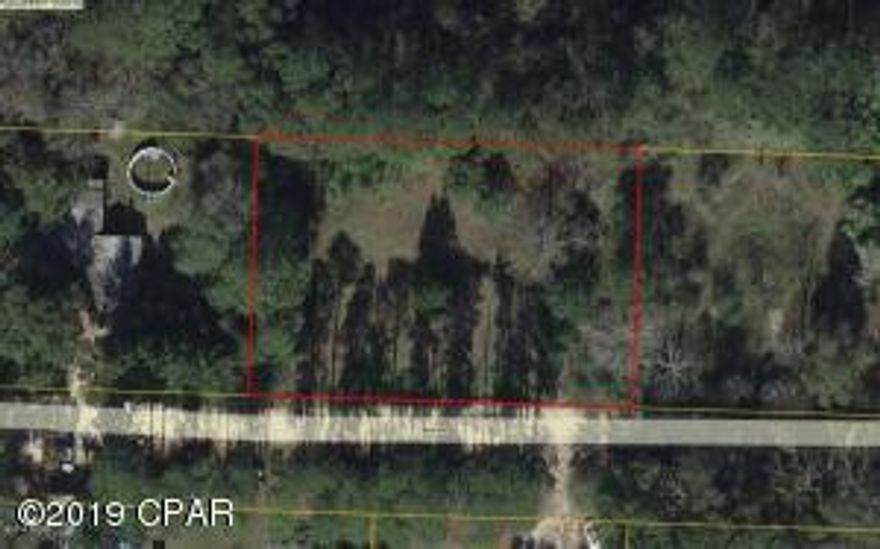 Cleared with a well and ready to build or put Mobile home on. This is minutes from Panama City, shopping, restaurants, and the Worlds Most Beautiful Beaches. Some of the best fishing lakes in North Florida, Marianna Caverns and Econfina Springs all just minutes away. Purchase for now or leave a legacy for your children.Info is believed to be accurate, in important, buyer should verify.