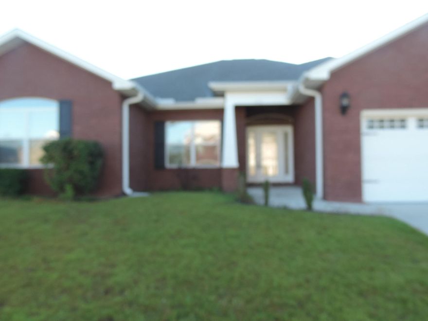 ** SHORT SALE ** Close to Duke Field! Solid Brick Exterior with over 2400 SF of Living Space! 10' Ceilings, Granite, Porcelain Tile, Designer Wood Cabinetry! Open Concept Living Areas! Fenced Backyard! Call for more information.