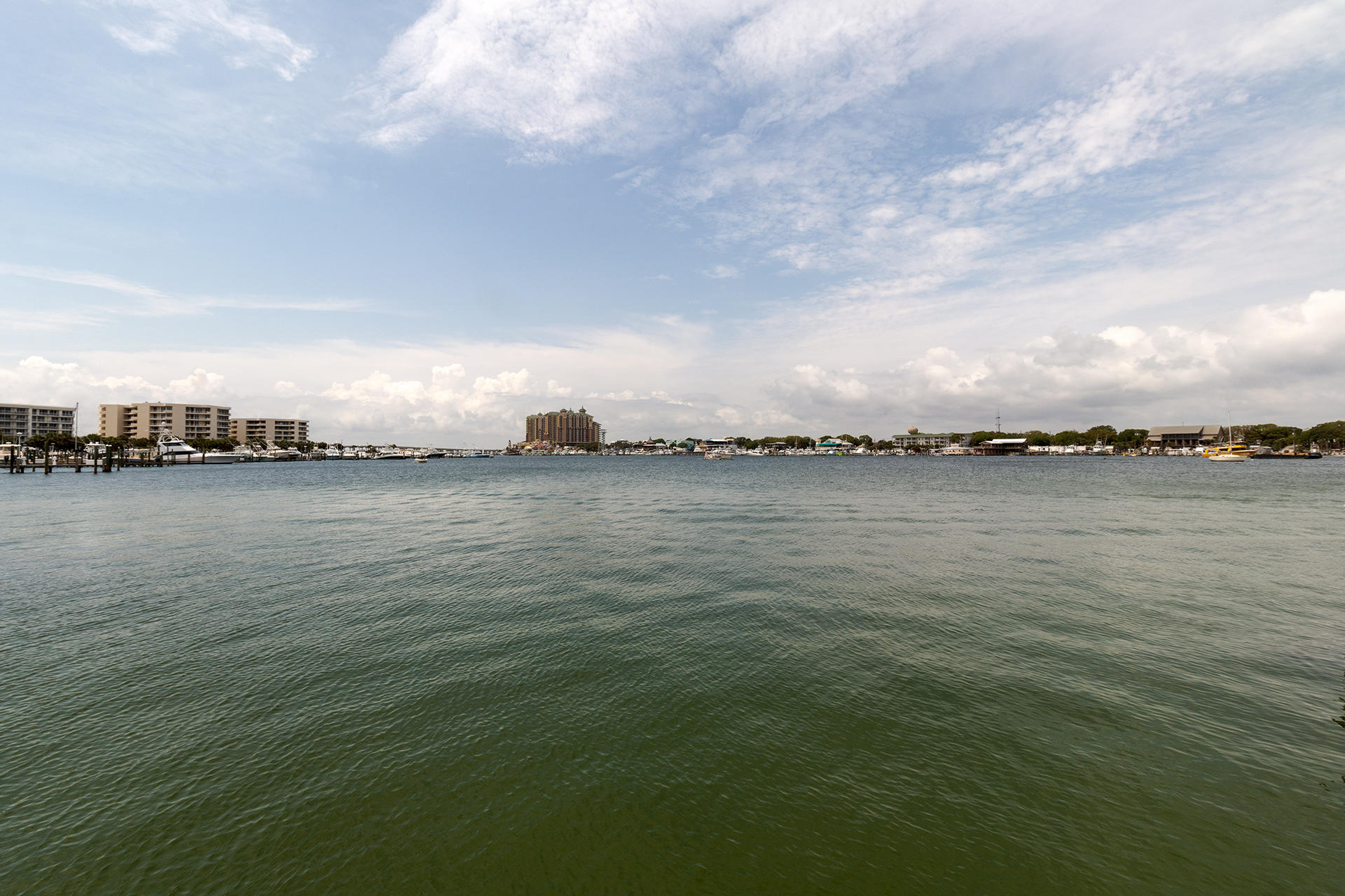 Motivated Seller. Perfect for the Boating Enthusiast. Amazing Harbor front, 4BR/3.5BA, 5,458SF home w/ 64FT on the Harbor, 2 large boat slips, & a jet ski lift. This home has a 2-car garage, plus an extra motor home/boat garage w/ sewer dump. Other unique features include an elevator & a large roof top terrace w/ views of the Gulf, Pass, & Harbor. Downstairs there are 2 bedrooms w/ access to the pool area, summer kitchen & dock. The 2nd floor has a large open living space w/ gourmet kitchen, full size bar, billiard area, & living room, & large balcony overlooking the Harbor. The 3rd floor features a large master suite, additional bedroom, & office area. The private master balcony has beautiful harbor view w/ access to the roof top terrace. This home is being sold as-is with furnishings.