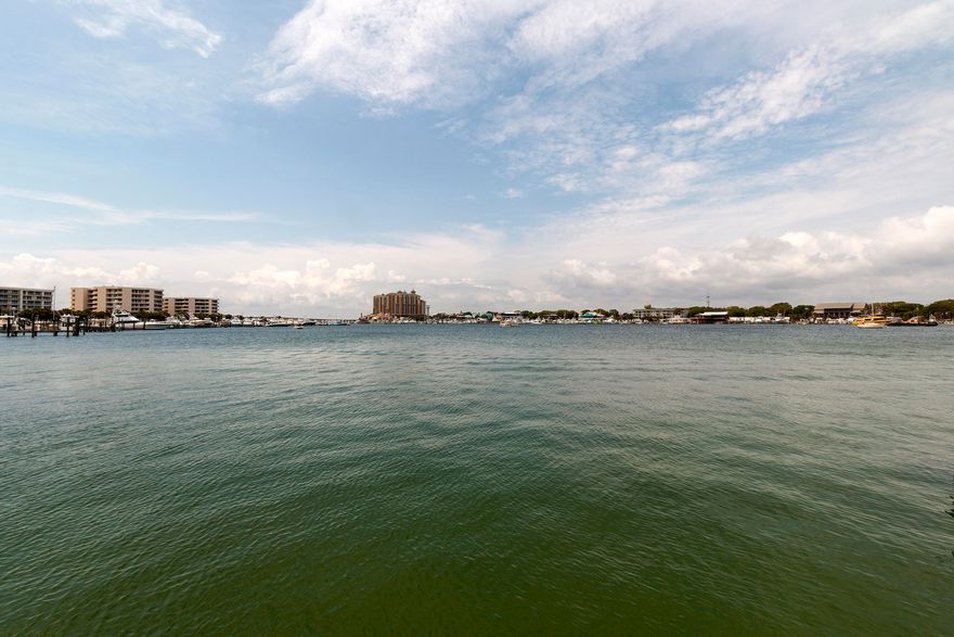 Motivated Seller. Perfect for the Boating Enthusiast. Amazing Harbor front, 4BR/3.5BA, 5,458SF home w/ 64FT on the Harbor, 2 large boat slips, & a jet ski lift. This home has a 2-car garage, plus an extra motor home/boat garage w/ sewer dump. Other unique features include an elevator & a large roof top terrace w/ views of the Gulf, Pass, & Harbor. Downstairs there are 2 bedrooms w/ access to the pool area, summer kitchen & dock. The 2nd floor has a large open living space w/ gourmet kitchen, full size bar, billiard area, & living room, & large balcony overlooking the Harbor. The 3rd floor features a large master suite, additional bedroom, & office area. The private master balcony has beautiful harbor view w/ access to the roof top terrace. This home is being sold as-is with furnishings.