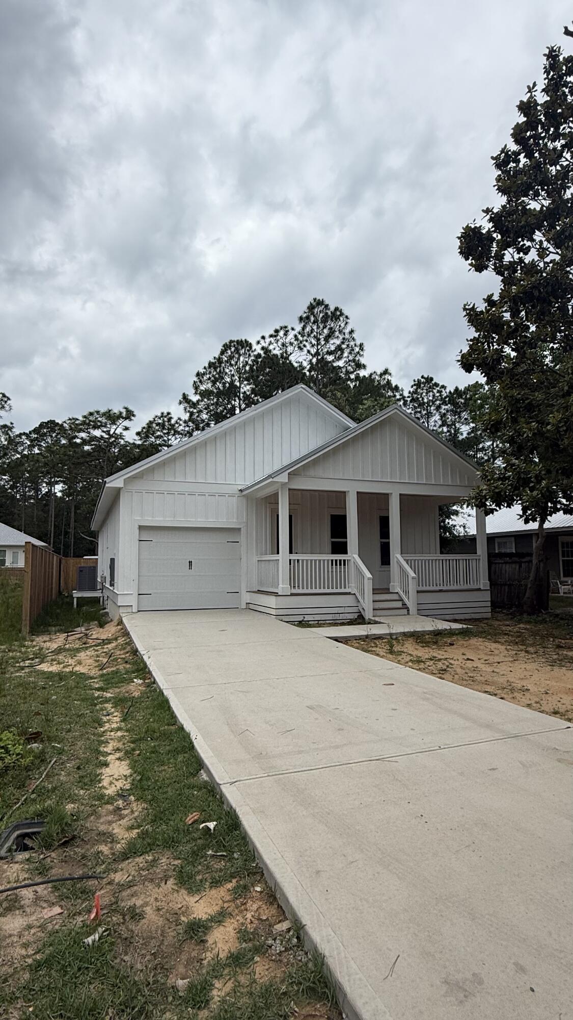 Beautiful NEW Home in North Santa Rosa beach ready for its first owner! This home has been perfectly designed to maximize space with a curated open floor plan. Along with that comes a front and back porch which is perfect for those Florida days and nights! As you walk through the house on the amazing LVP through the foyer you step into the living room and open concept kitchen complete with an island/breakfast bar. The crown moulding helps exemplify the beautiful 10 ft walls. The master bedroom is tucked away right off the living room with his and her closests along with its own master bathroom and tiled shower. The backyard has plenty of space along with a 10 ft privacy fence which helps maintain the quaintness of those Florida days.