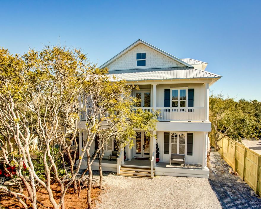 Gorgeous new construction in one of the most desirable stretches of 30A! This stunning 3-story home is not only beautiful but bright, spacious and loaded with conveniences! Featuring high ceilings, scraped/recycled walnut floors, incredible white marble countertops sealed with M3 sealant, and modern fixtures, it's perfect for a beach lifestyle that is both elegant and relaxed.The fabulous kitchen offers a huge island with breakfast bar and pendant lights, extensive white cabinets, and a large, undermount stainless sink. The appliances are all stainless Thermidor, including a 48 range with custom hood, a 48 fridge/freezer, professional dishwasher, and more. The adjoining living area opens to the back porchand both enjoy gas fireplaces for indoor/outdoor living and year-round comfort