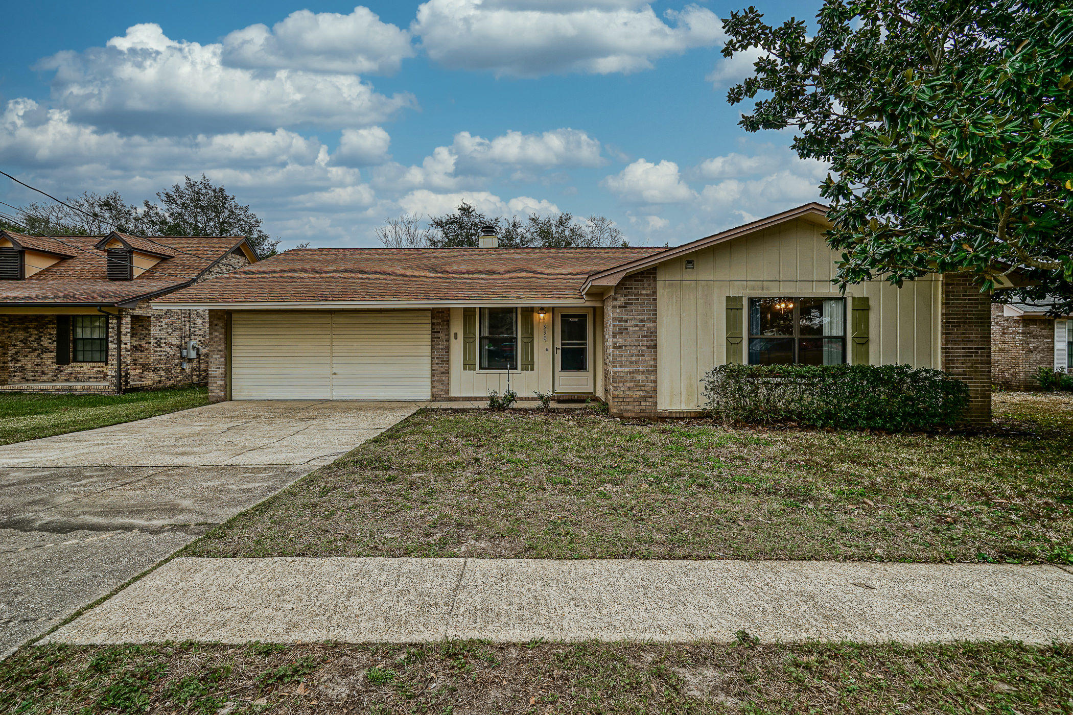 Welcome home ! This 3 bedroom/2 bathroom home in West Destin is located in an established neighborhood close to Everything! Upon entering the front door you are greeted by a large living area with brick fireplace and crown molding, the dining area also has crown molding with french doors leading to the new oversized exterior deck perfect for entertaining or just hanging out in the fenced backyard. The large open kitchen has lots of cabinets and counterspace, There are 3 large size bedrooms and both bathrooms have been updated with solid top vanities. The 2 car garage has storage space in the attic and shelving to store all your tools. This is a great home and it has a lot to offer so schedule your showing today!