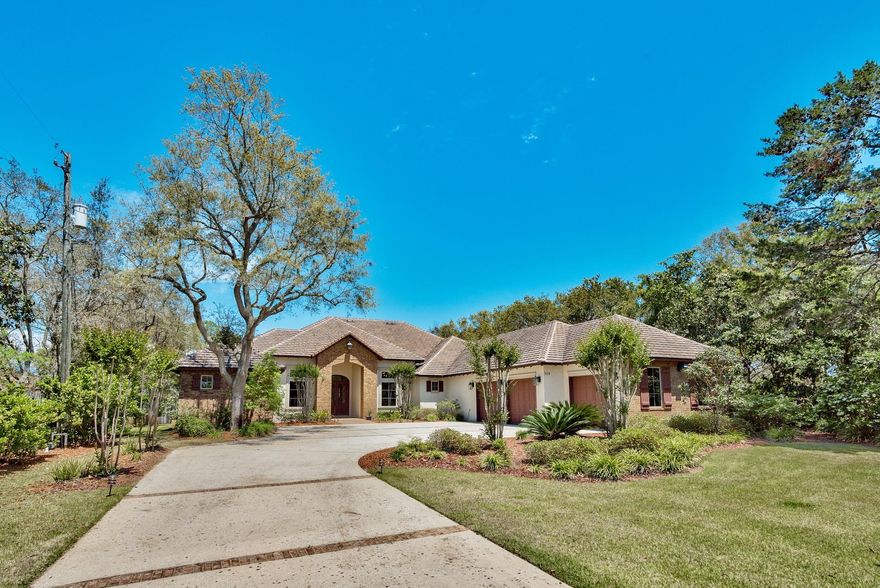 Luxury custom-built single-story waterfront home on Joe's Bayou. Elegant 4225 sq ft, 4 bedroom, 4.5 bath home on a -3/4 acre lot with 100' of deep waterfront and impressive 2 boat dock with lift. Enjoy the outdoors with your private dock (with electric, water and lighting) accommodating 2 boats, one side has a 9000 lb boat lift and a paddleboard/kayak swim deck. The 900 sq ft lanai covers the outdoor living and dining area, fireplace and newly built summer kitchen with bar. The pool overlooks the beautifully tiered landscaping leading to the water. Great for outdoor entertaining! Around the corner from the pool is the outdoor shower and large storage closet for all your water toys. Walk inside the custom hardwood doors and you will notice the high quality crown molding and baseboards well at the beautiful large wood beams, travertine and hardwood flooring.  You will walk into the spacious formal living room with fireplace or the great room with a custom built entertainment center and breakfast bar and dining area.  The kitchen features commercial grade Viking appliances, prep-island with its own stainless steel sink, granite countertops, plenty of cabinets and a separate pantry, a gourmet chef's dream!   The master suite area encompasses the entire west side of the home and features a sitting area overlooking the pool and water, beautiful trayed and coffered ceilings, his and her walk in closets, a unique double-sided vanity, oversized walk-in shower with 7 shower heads, an oversized tub and private water closet.  The three additional bedroom suites offer unique granite and tile designs and each have a walk-in closet.   The formal dining room is huge and the study features French doors and built-in bookshelves and desk.  Additionally, there is a butler's pantry with a wet bar and plenty of cabinet space, a stylish Â½ bath opening both inside and out to the pool and an oversized laundry room.   The three-car garage has tons of storage space and a separate walk-in storage closet.  Joes Bayou is the closest protected deep water bayou to the gulf and NO FLOOD INSURANCE is required.  The sprinkler system has it's own well and pump.  Seawall added in 2014.  This distinctive, spacious waterfront home is perfect for your outdoor lifestyle.