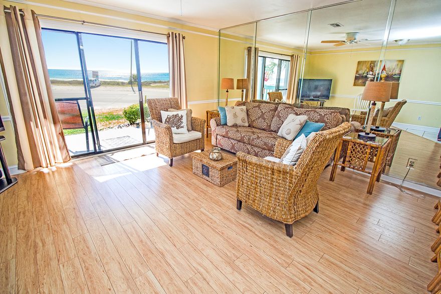 YOUR VERY OWN DEDICATED BEACH!!! **Home comes furnished as seen at showing!!!** THIS IS A GREAT INVESTMENT!!! This 1-story FIRST FLOOR condo with breath-taking and unobstructed views of the gulf comes furnished with dedicated Laguna Beach access! Bunk beds in the hallway, and unit sleeps 6 people! This is a hard unit to come across on today's market! No elevator to deal with or busy crowds!!! The home has been updated and is *rental ready!* There is also a community pool and BBQ Pit area. It's a 1BR/1.5BA unit at the West End of the beach located right next to the Carousel Supermarket making grocery shopping a breeze. This unit is in a great location with tons of convenience. This home also has wide open gulf views! **The beach in front of this unit is protected and can never be built on!*