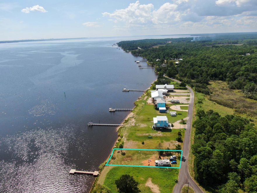 Beautiful BAY FRONT slice of paradise with 61 ft of water frontage on the Choctawhatchee Bay and just outside the mouth of LaGrange Bayou. Cleared lot with utilities in place. NO Hoa. New Survey.