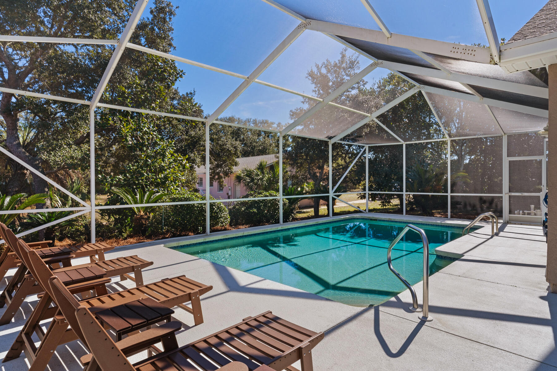 This charming 2-bedroom, 2-bath beach house is located in the coveted community of Santa Monica Beach. This neighborhood offers exclusive, deeded, and gated beach access, providing you with direct access to the pristine shoreline. Enjoy the beauty and serenity of the beach while being conveniently close to local restaurants, shops, and the renowned 30A. Inside, the home is a thoughtfully designed open living space with ample natural light throughout. The open concept connects the living, dining and kitchen, creating an ideal space for entertaining. The primary suite is the perfect space for relaxation and comfort, with direct access to your covered, back patio and large screened in pool area. Your outdoor oasis awaits, providing a retreat for relaxation and enjoyment. The large screened in porch offers ample space for seating and entertainment while overlooking your private pool. Step outside to enjoy the community's peaceful coastal atmosphere. Imagine living just minutes away from the sugary sand beaches and emerald waters Panama City Beach has to offer. Conveniently located near shopping and restaurants and situated in the highly sought after community of Santa Monica Beach, complete with your own dedicated beach access just a short stroll away and no rental restrictions.