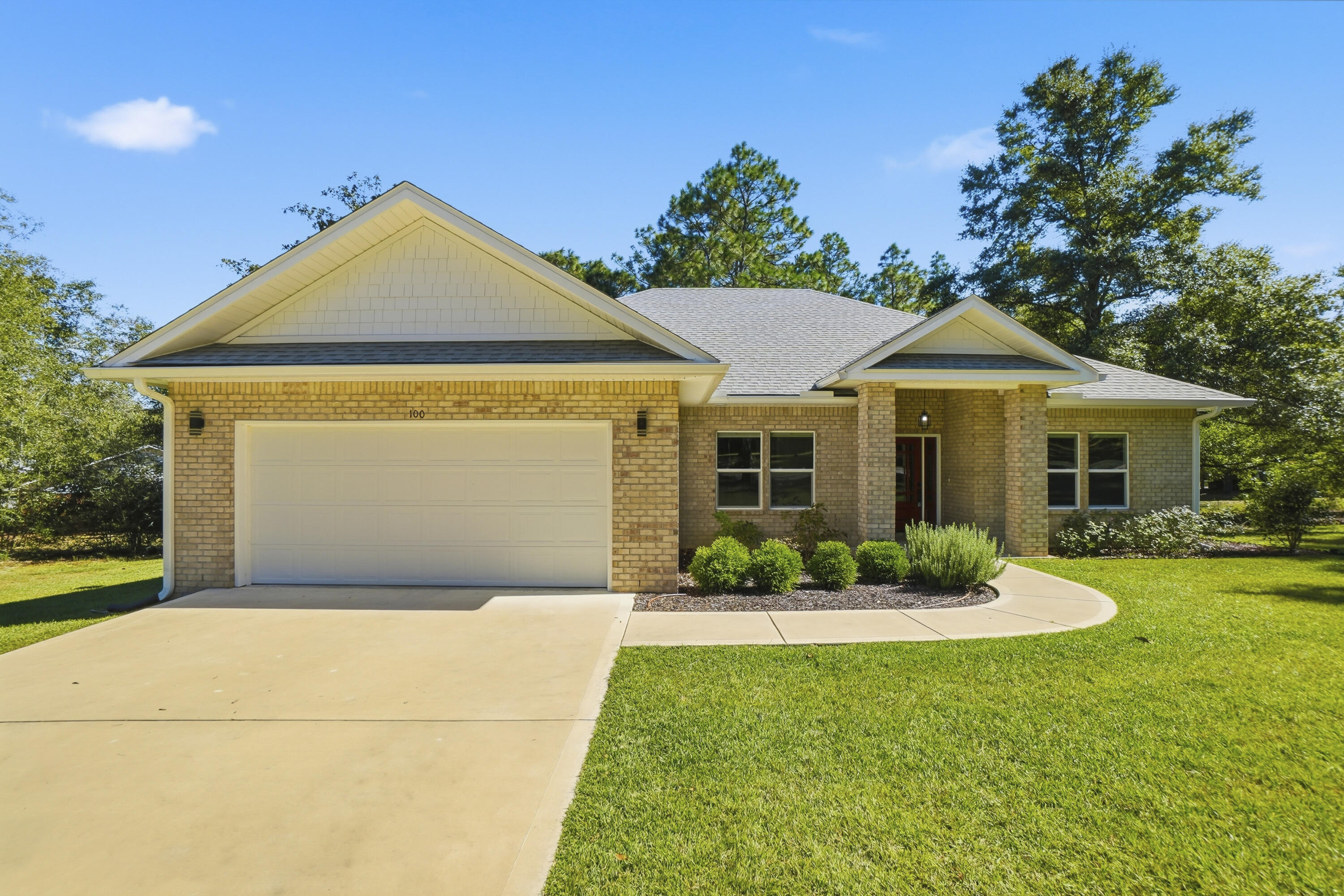 This stunning 4-bedroom, 2.5-bath brick home redefines quality craftsmanship and modern comfort on .75 acres. From the moment you step inside, the barrel-vault pine ceiling in the foyer sets the tone for a home that's truly exceptional. The living area opens up under a breathtaking tongue-and-groove cathedral ceiling, blending warmth and elegance throughout the open layout. The gourmet kitchen is the showpiece of the home featuring sleek quartz countertops, an eye-catching gray and white backsplash top-of-the-line stainless appliances, and an impressive nearly 13-foot island perfect for family gatherings or entertaining guests. Enjoy premium luxury vinyl plank and tile flooring throughout- no carpet- making the home both stylish and easy to maintain. The primary suite is a peaceful retreat with large windows, a tray ceiling, spa-inspired bath boasting a soaking tub,5-foot tiled shower, dual vanities, and a custom walk-in closet with built-ins. Additional highlights include a split-bedroom floor plan, screened covered porch, two-car garage, and Rachio smart irrigation system for effortless outdoor upkeep. Seller have thought of everything, right down to the amazing STARLINK internet.  Immaculately maintained and like new, this home blends thoughtful design with timeless quality the kind rarely found in today's market. Come see why this property stands above the rest schedule your private showing today before it's gone!