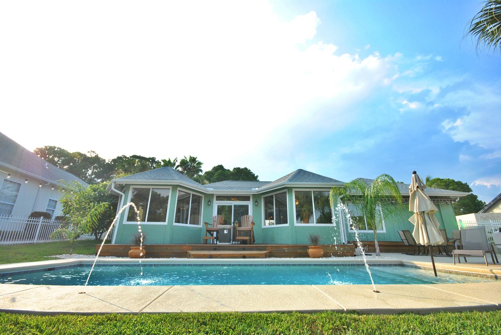 This fabulous updated canal front 3 bedroom 2 bath home is now available for the buyer/boater looking for a home with the perfect outdoor setting! The owners have spared no expense in creating a private, relaxing resort atmosphere with access to the Gulf from the back yard!! Beautifully landscaped with exterior lighting, the backyard over looks the canal where the owners have installed new pilings, fish cleaning station with water hook up, private LED lighted pool with sun-shelf ledge, complete with umbrella holder,6 person hot tub equipped with TV/DVD player, stereo, and deck jet water features. Additionally, there is a remote controlled retractable awning to cover a large entertaining space on the patio. The interior features a fully tiled great room with raised 12' ceilings,