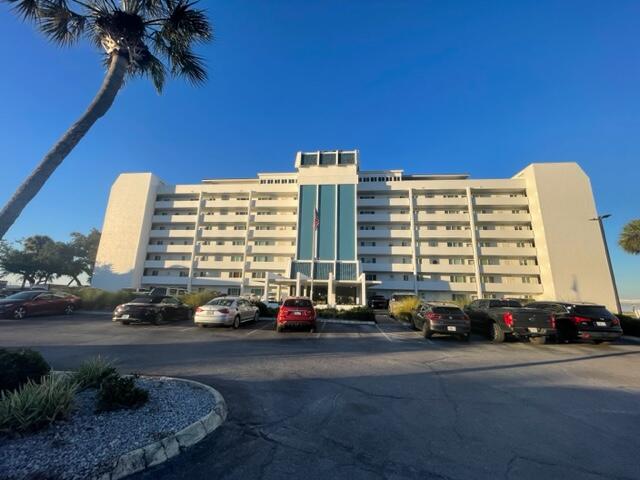 A rare opportunity for a beautiful ground floor unit with glorious year round westerly facing sunsets over St Andrews Bay. Cove Condominium is located in a prime location on the corner of Cherry St and Beach Drive near newly renovated and revitalized Downtown Panama City. This beautifully renovated and decorated 1 bedroom 1 bath waterfront unit is absolutely turn key and and move in ready. Home has a full and spacious kitchen with trey ceiling accent, stainless steel appliances, granite countertops, multiple custom cabinets, and a breakfast bar. Generous living and dining area with dining table, couch, large ottoman, consoles, TV, end tables, and ceiling fan. This leads into a large conditioned sun room with expansive views of St Andrews Bay and Redfish Point where spectacular sunsets are