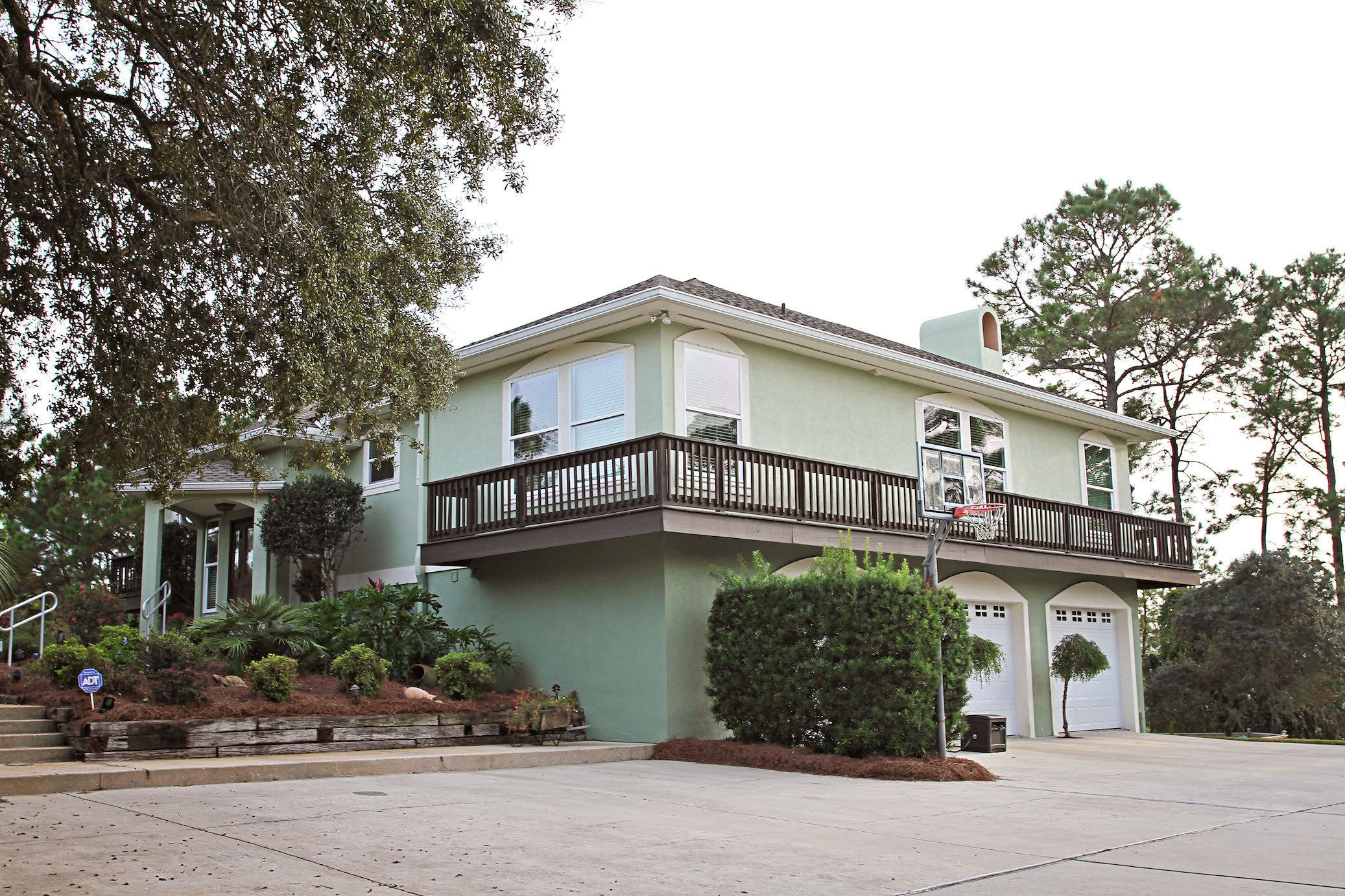 Water front home (actually 2 lots), has spectacular views of Oyster Lake and a glimpse of the Gulf of Mexico (accessible via the lake or the foot bridge). Tucked away on almost 2 acres of lush foliage and mature trees, this setting is a nature lover's paradise. Savor the natural surroundings from one of two decks or as you lounge by the pool. Outdoor life on the lake allows for fishing, canoeing, and other water activities. Property includes a fully functional RV pad and a Garden Shed with ramp for Golf Cart. Kitchen has Granite countertops, stainless steel appliances and custom cabinets. The master bedroom is light and spacious with an on suite bath, double vanity, Jacuzzi tub and huge walk-in shower. Upgrades include new impact glass, vinyl clad windows and reinforced garage doors.