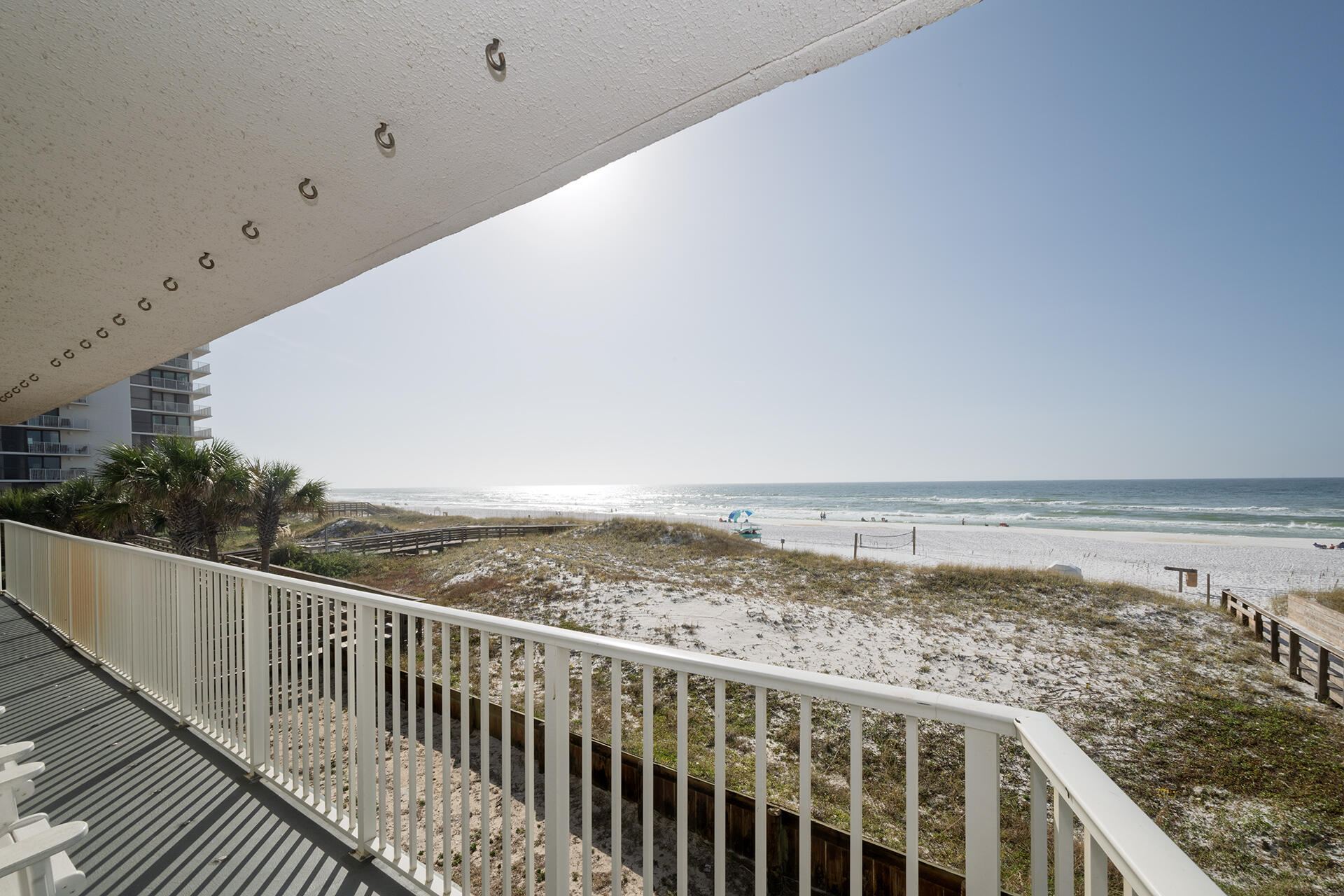 Gorgeous panoramic Gulf & Beach Views from this 1st Floor, 3BR/2BA, 1,315SF, front unit with wrap around balcony & steps down to the Beach.  These units rarely come up and are highly sought after.   This unit features a large wrap around balcony, with private steps down to the boardwalk and beach.  The kitchen features quartz countertops, breakfast bar, stainless appliances, & amazing views.  The living space is large and offers beautiful views, dining area and balcony access.  The master suite has private balcony access, sitting area, vanity, & jetted tub.  Other features include two additional bedrooms, one with private balcony access, a full hallway bath, outside storage, & owner closet.  Don't miss this great opportunity to own this amazing unit at Mainsail.