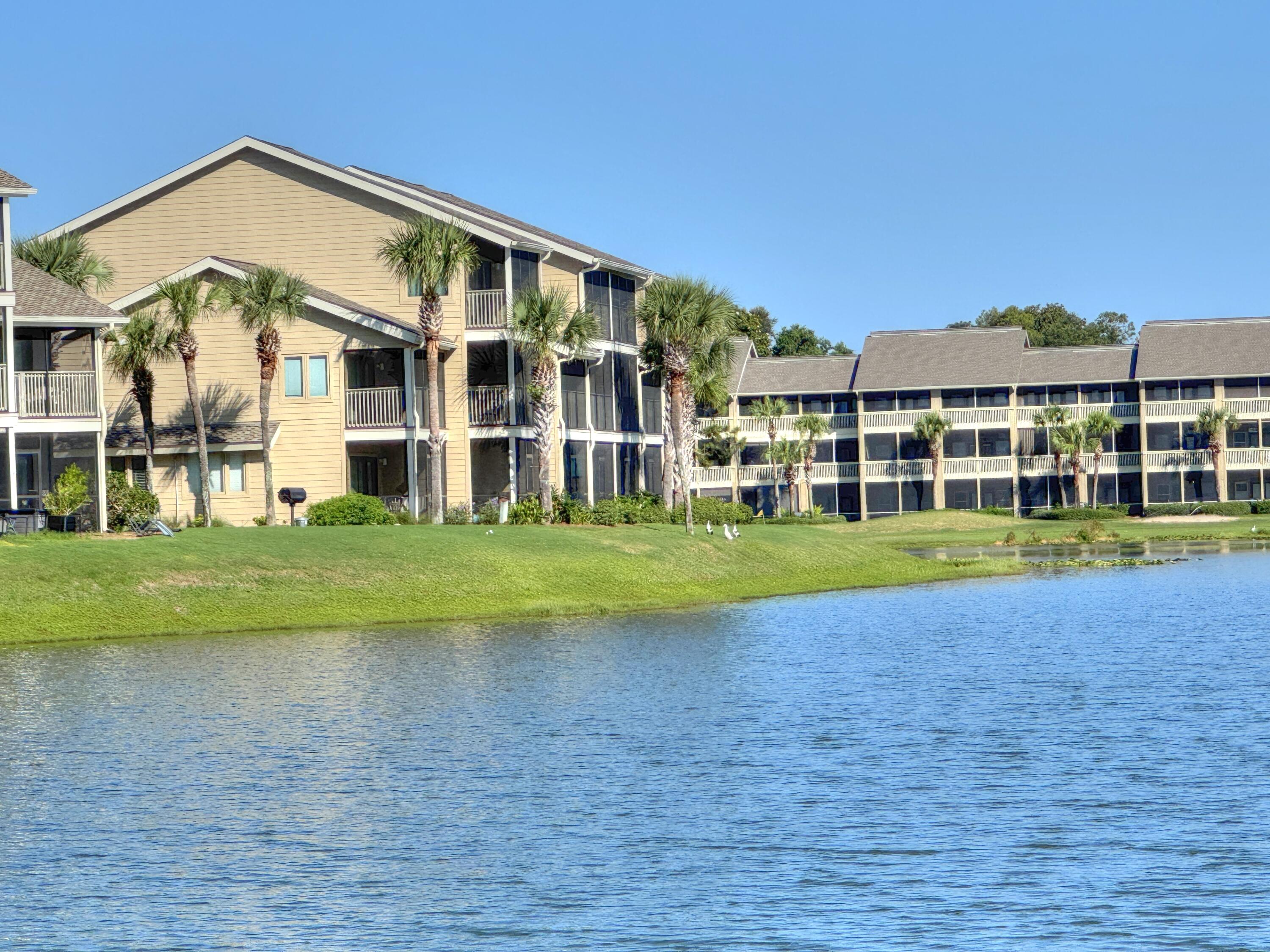 Enjoy the swimming pool, directly across the parking lot, head to the beach across Scenic Hwy 98, play tennis of pickleball, sip coffee on the screened patio, or enjoy the Whales Tail, for some food or a cocktail, while enjoying the white sands and the emerald blue waters of the gulf. This unit is one of the closest to the beach and located on the lake. It's one of the few units with a larger porch.Major updates on the exterior have been completed. Two large special assessments will be paid by the seller, at closing, with a reasonable offer.