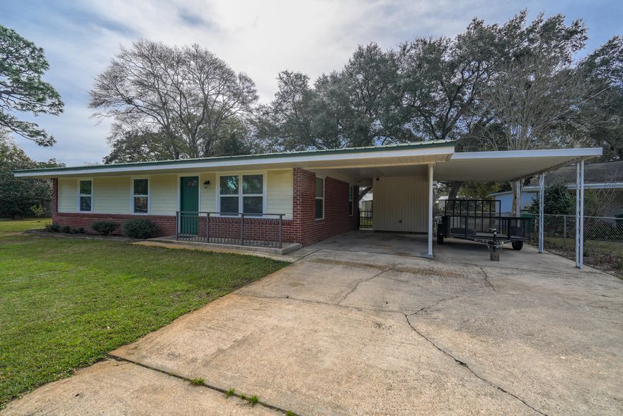 WOW, this home has been completely revamped with new wiring, plumbing, windows, paint, etc. Stunning kitchen with all new appliances and Lifeproof vinyl plank flooring throughout. The whole-house generator has been serviced yearly and will keep you cool during a hurricane. The extra large lot has a workshop/garage, a storage building, chicken coop, and pump & sprinkler system convey ''AS IS.'' Convenient to Publix on Eglin Pkwy and other businesses nearby. Ten minutes from Eglin gate. Call for your appt. to view it with your favorite real estate agent.