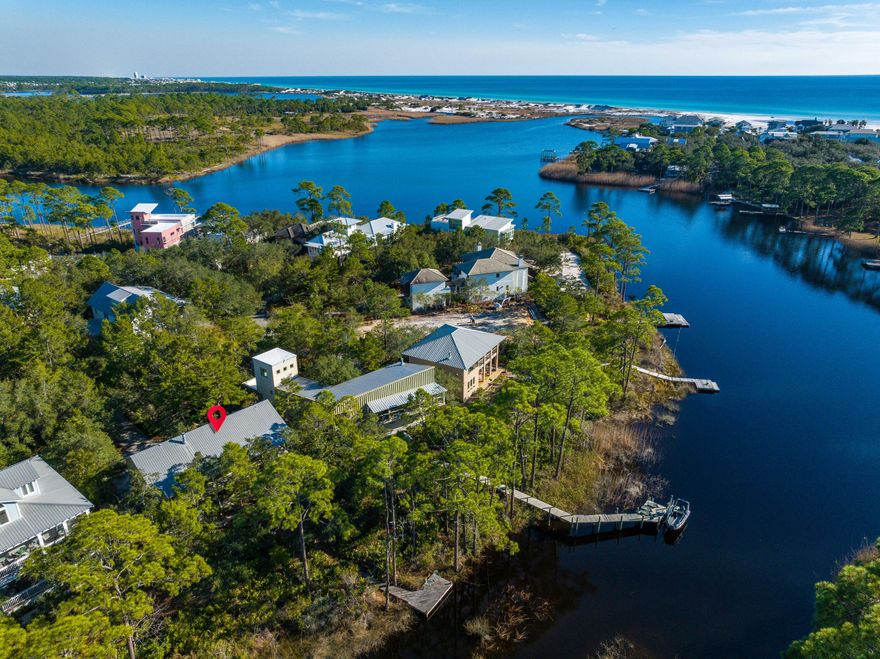 ***We are back on the market through no fault of the seller! With 7000' of uninterrupted, publicly owned Gulf of Mexico shoreline amidst thousands of acres of state park land all within an easy bike, paddle or walking distance, this home, located in the secluded, gated south of 30A neighborhood of The Lake Place in Grayton Beach is the perfect location for beach and lakefront living. Being on Western Lake, one of the largest of the globally rare Coastal Dune Lakes you will enjoy the serenity of your own dock as well as the private community pool, park and large neighborhood dock and entertaining areas. The Lake Place is conveniently adjacent to Grayton Beach State Park and importantly for full timers or true second home owners, does not allow short-term rentals. You can boat or paddleboard toGrayton beach, The Red Bar and Chiringo or take a short bike ride or stroll to nearby boutique shopping and numerous delicious restaurants, including Borago and Grayton Seafood Co. This unique "dog trot" style home was thoughtfully designed by nationally recognized Sala Architecture for this specific lot and location on Western Lake and offers an open floor plan and living area with an abundance of windows flooding it with natural light and views of the beautiful, wooded lot. The living room provides the enjoyment of a gas fireplace and a spacious (54' long) lakeside balcony that provides an excellent flow for entertaining. An additional living area is located on the first level and there is plenty of room for an addition. If desired, plans are available for a carriage house and garage. The Lake Place is a 20 acre property on the beach side of 30A surrounded by State park and Western Lake. Enjoy the serenity of nature and the very best of 30A living in this convenient, yet quiet Grayton location.