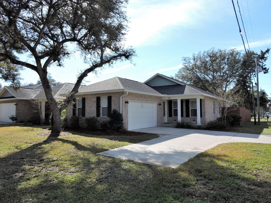 Beautiful all brick low maintenance, like new home with a beautiful fenced, private back yard. Open floorplan with hardwood floors in all the main areas and the master bedroom. Kitchen has granite, stainless steel appliances, a super cool wine (or coffee) bar, and a nice pantry. Master suite has a great walk-in closet, walk-in shower, and double vanities. Second bath has a tub/shower combo. There are 3 more bedrooms. The screened in back porch is a great spot with a fabulous view of the back yard. There is a laundry room too. The double garage has plenty of room for your toys. This is a fantastic home with a very new and updated design feel!