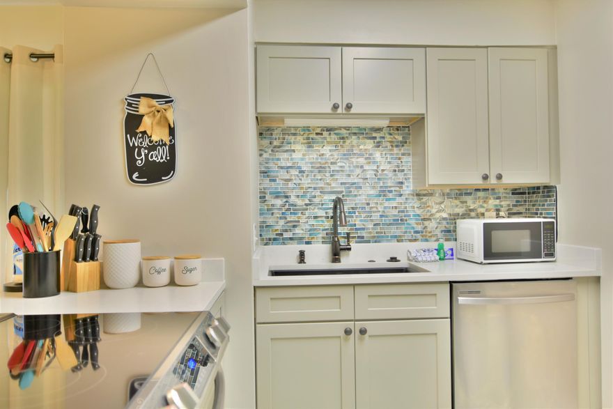 Located in the heart of Destin, and beautifully updated with all new flooring, new stainless appliances, new quartz counter tops, huge new kitchen sink, new cabinets, fresh paint, new AC in 2020. Spacious deck overlooking the beautiful lake and short walking distance to the beach! Amenities in this gated community include: 3 pools, tennis courts, grills and community room.Tremendous investment opportunity!