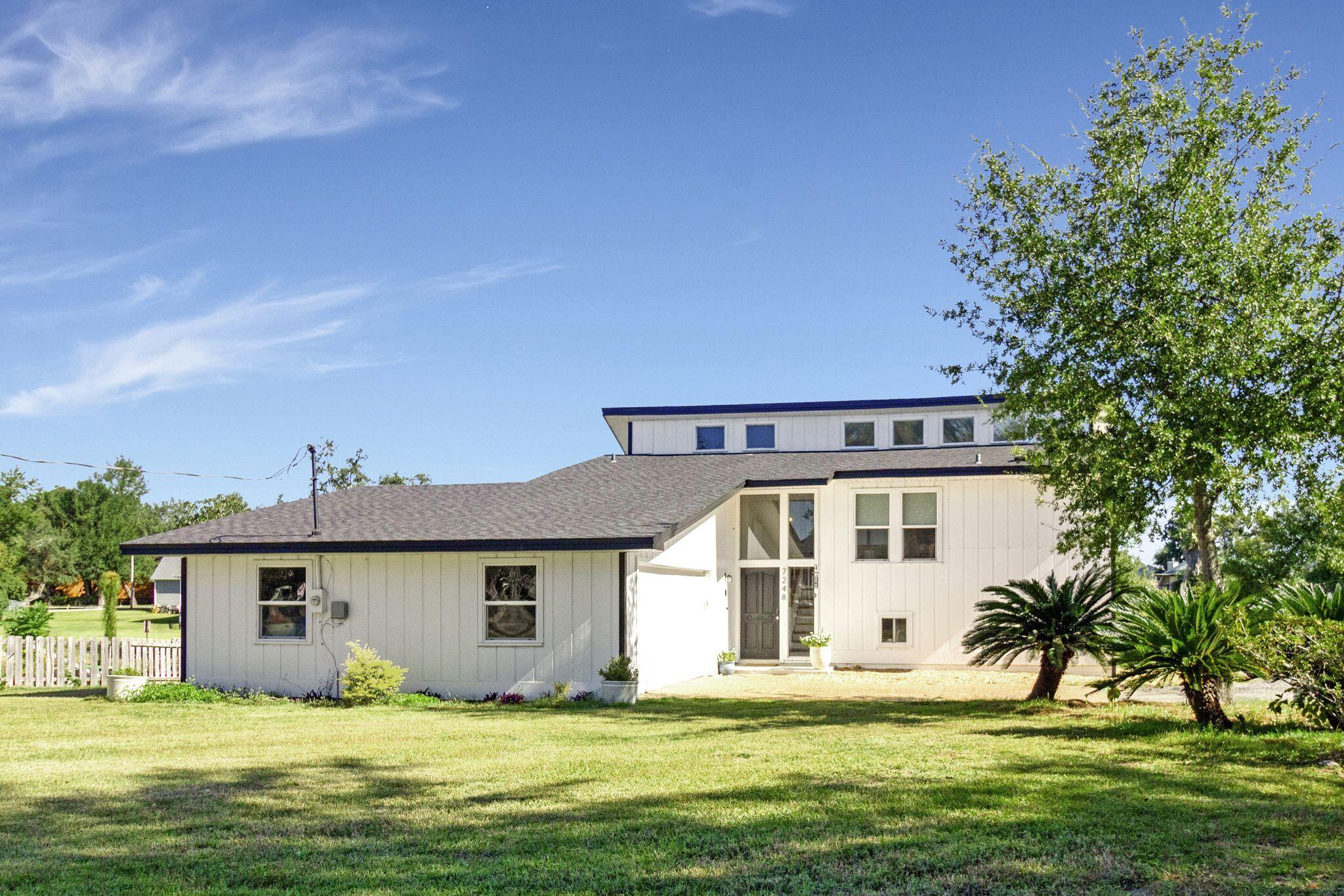 Welcome Home To This Lynn Haven Area Canal Front Home With Access To Deerpoint Lake. Assumable Loan at 2.875%. NEW, NEW & NEWER Describes This Remodeled Home That Has An Effective Date Of 2020.  The Home Features Tons Of Windows And Is Light, Bright And Spacious With Almost 3/4 Of An Acre Yard With Canal Access And Firepit Area. 4 Bedrooms, Open Concept, Spacious Master Suite, Additional Living Room For The Kids Or Mancave. This Home Is For You.  You Can Store Your Boat Or RV Next To Your Own Home And Access Deerpoint Lake For A Wonderful Day Of Fishing Or A Day Out On The Lake With The Family.   Features: Attached Dbl Garage. New & Newer Items: Roof, HVAC, Culligan System, Kitchen, Quartz Counters, Baths, Flooring, Windows, Lighting, Woodwork, Beams, Deck, Septic System Etc. NO HOA Home Also Features A Working Wood Burning Fireplace. A New Dock Is Allowed. Room Sizes Are All approx.  Buyer To Verify Any And All Info For Themselves