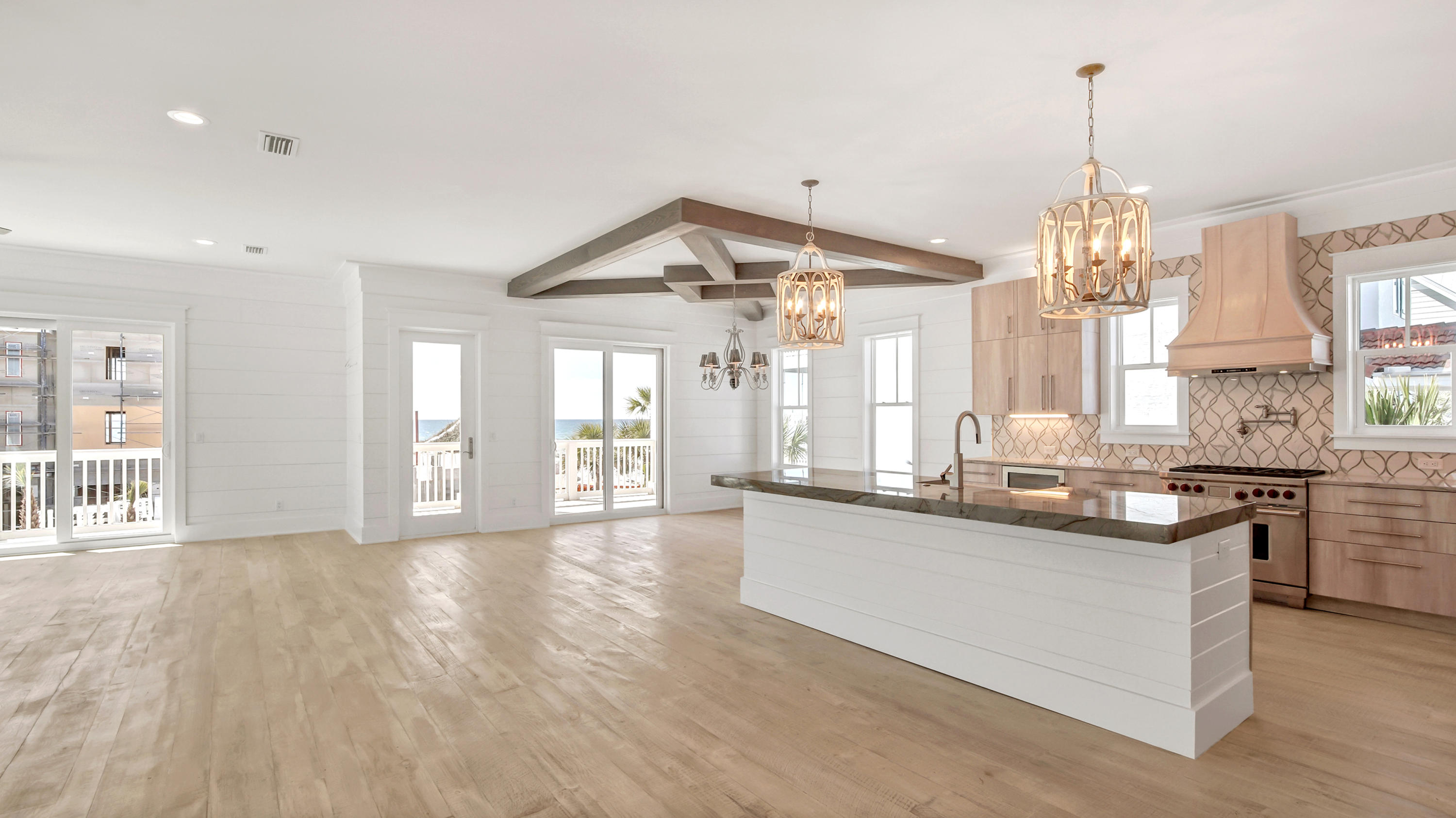 THIS COULD BE THE ONE YOU HAVE BEEN WAITING FOR New construction just completed. Gulf and Lake views from this large 6 bedroon home one lot off the beach located in Seagrove area. The 1st floor offers a separate living area overlooking pool and has it's own kitchen. On the 2nd floor is the expansive living area a nd 2 bedrooms. Cypress beams in the dining area add to the many features of the home. Flooring throughout home is custom milled White Oak, Baths are marble flooring. Large balconies are on each floor to take advantage of Gulf views and sunsets.Wolf appliances in kitchen. Two large master suites are on 3rd floor as well as a extra sitting area with wetbar.