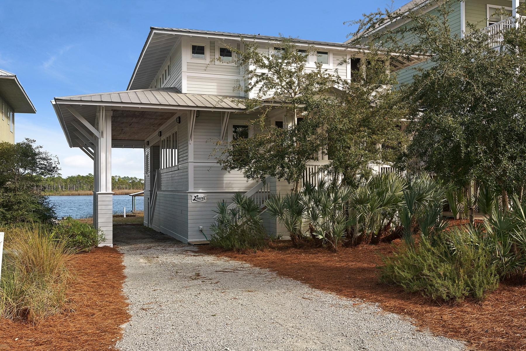 Recently reduced $200,000! Make offer!This southern classic coastal home has several features that make it quite unique for Grayton Beach. It's only one of three homes in Grayton that have backyard dock access to Western Lake and also commands enticing views of the Gulf of Mexico ... the beach boardwalk is just across the quaint street in front of the house. It offers memorable inside-outside living, with generous wrap-around screened and open porches, shaded by overhangs keeping the sun off and breezes flowing in through the live oak trees and saw palmettos.Lots of windows let in fresh daylight and ceiling fans create a cool breeze throughout.
