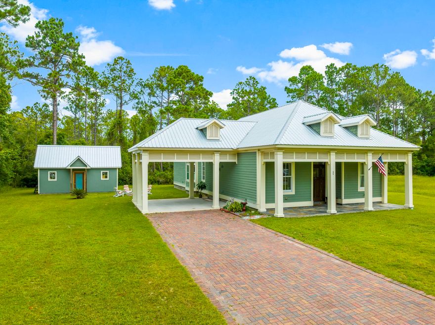 Discover tranquility in this custom 2-bedroom, 2-bath home with a large bonus room, situated on over half an acre and backing up to the state forest. Just a short walk to Gulf Place, you'll enjoy easy access to popular restaurants, shops, and entertainment, as well as the Ed Walline Beach Access with plenty of public parking.High-end finishes are featured throughout, including white oak floors, Venetian plaster, and a spacious screened porch. The home also includes a detached garage and an expansive lot with ample room to add a pool.With no HOA, this property is a rare opportunity for buyers seeking coastal living without restrictions. Ideal as a primary residence, vacation home, or income-producing property.
